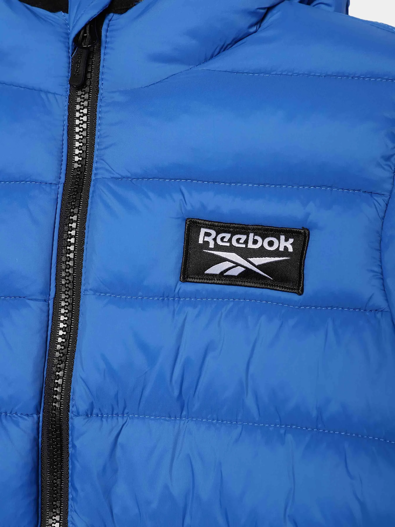 Куртки и дубленки Reebok модель OCRB1063TK_BLUE Куртки и дубленки Reebok модель OCRB1063TK_BLUE Фото
