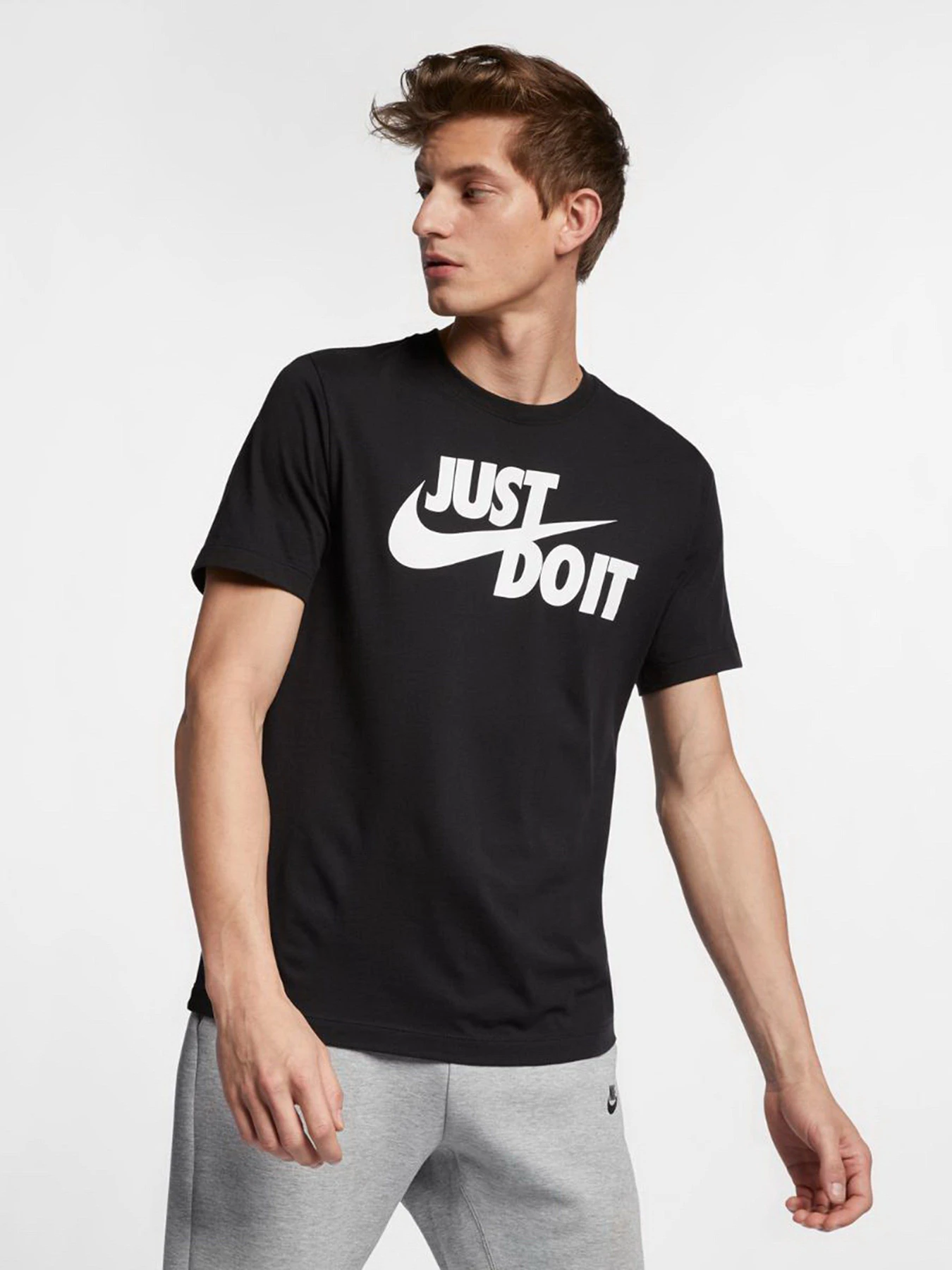 Футболки и поло NIKE NSW TEE JUST DO IT SWOOSH модель AR5006-011 Фото