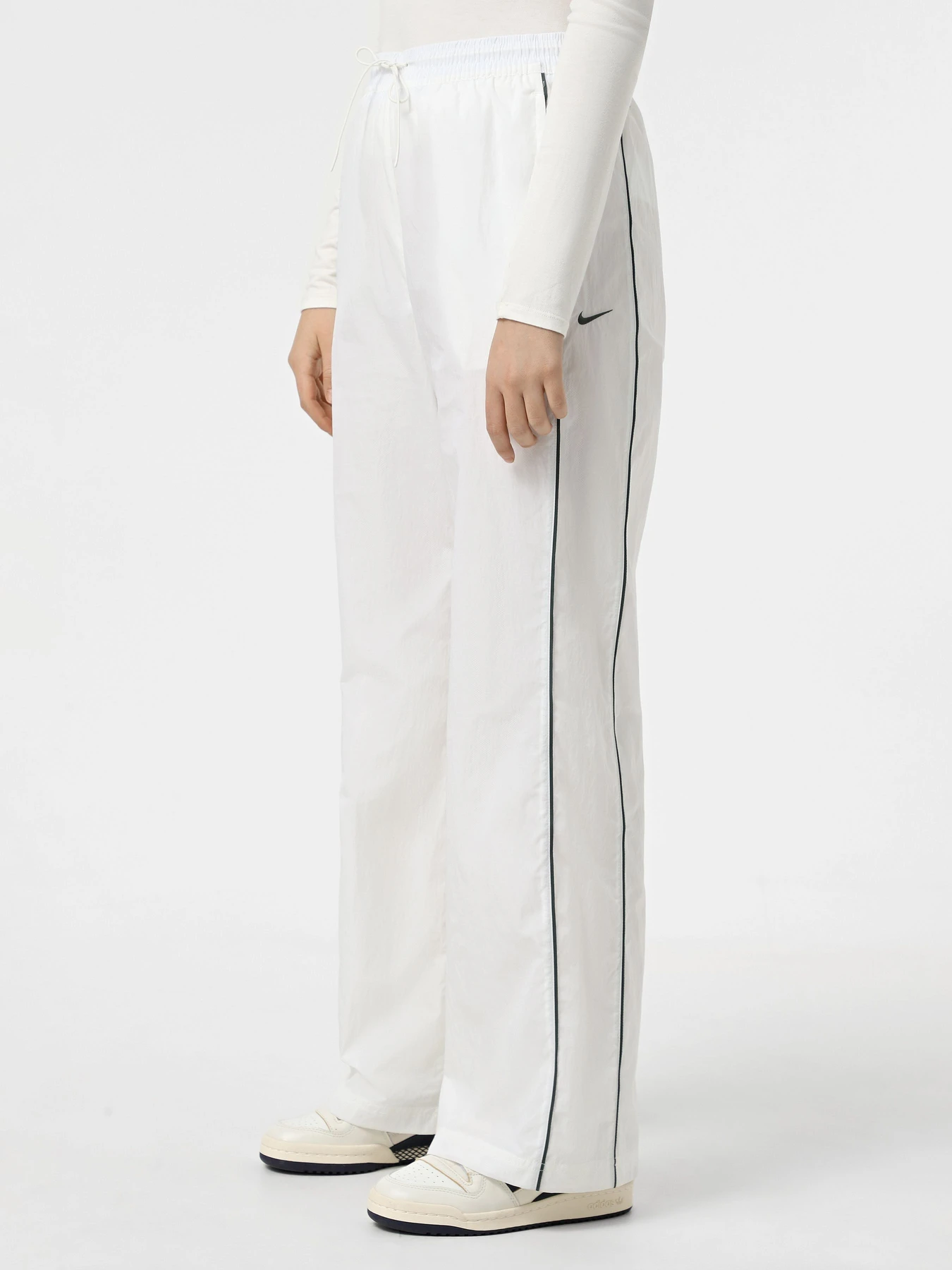 Брюки NIKE WINDRUNNER модель FV7655-134 Фото