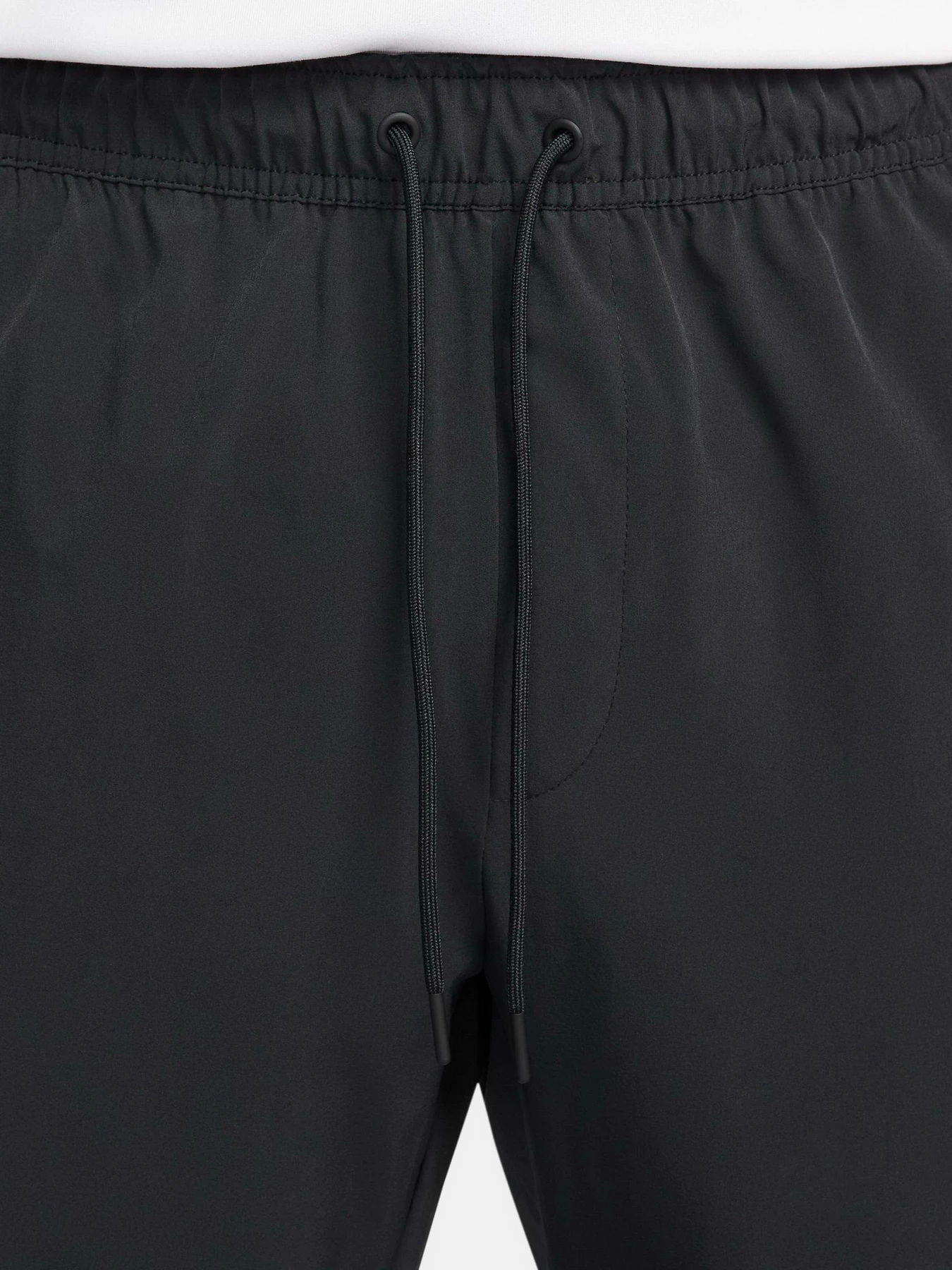 Брюки NIKE DRI-FIT UNLIMITED PANT TAPERED модель FB7548-010 Брюки NIKE DRI-FIT UNLIMITED PANT TAPERED модель FB7548-010 Фото