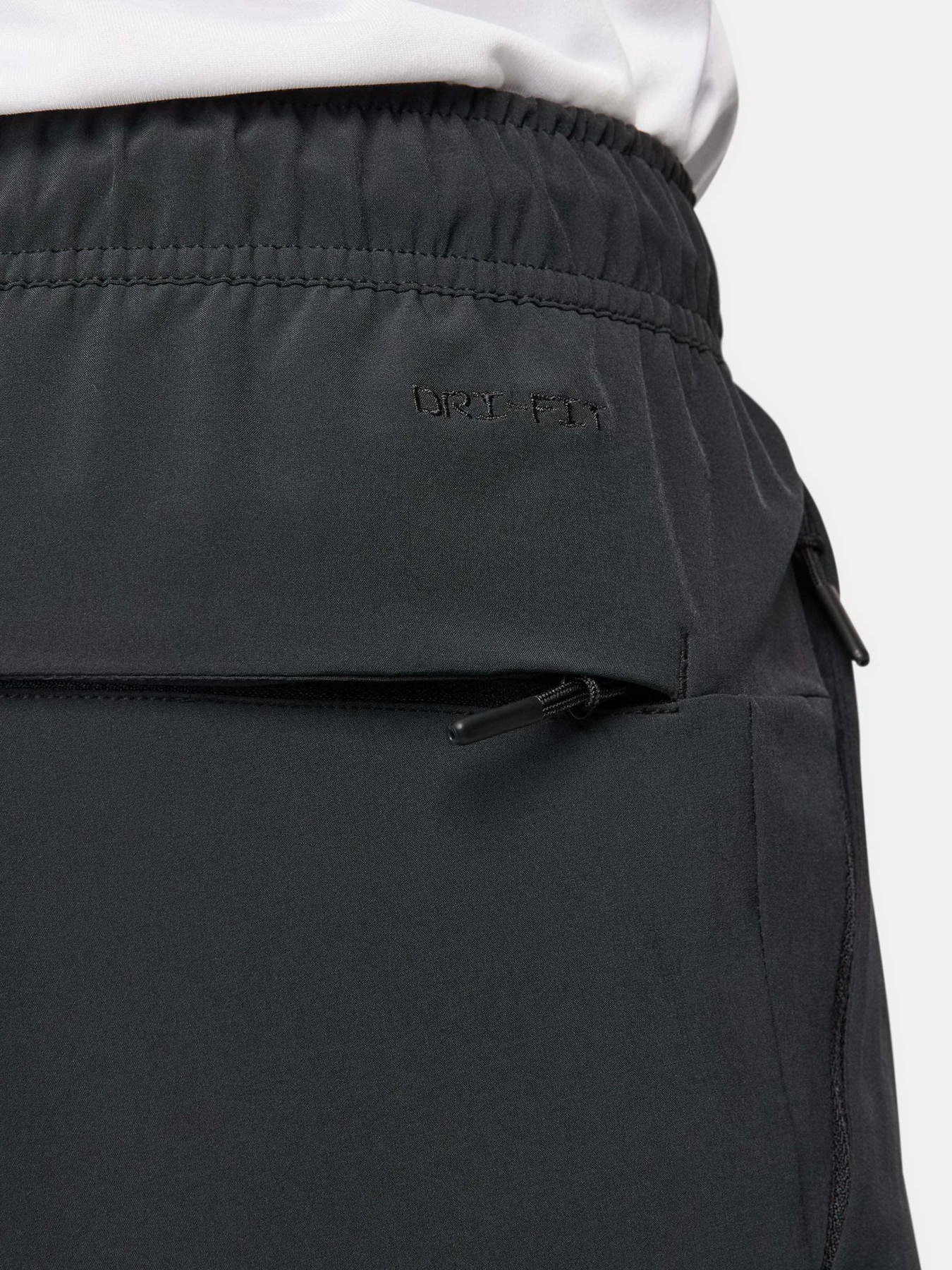 Брюки NIKE DRI-FIT UNLIMITED PANT TAPERED модель FB7548-010 Брюки NIKE DRI-FIT UNLIMITED PANT TAPERED модель FB7548-010 Фото
