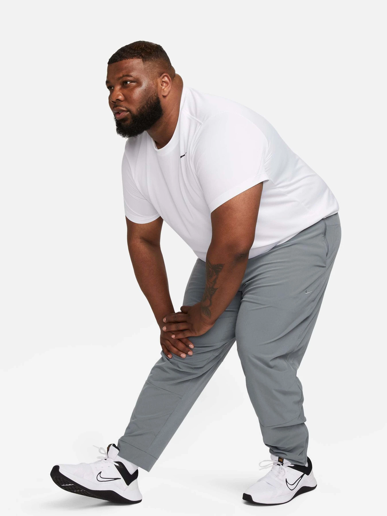 Брюки NIKE DRI-FIT UNLIMITED TAPERED LEG модель FB7548-084 Брюки NIKE DRI-FIT UNLIMITED TAPERED LEG модель FB7548-084 Фото