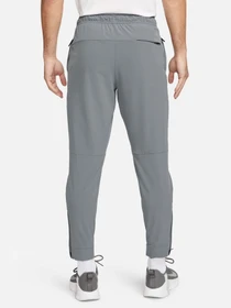 Брюки NIKE DRI-FIT UNLIMITED TAPERED LEG модель FB7548-084 Фото