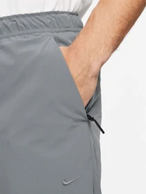 Брюки NIKE DRI-FIT UNLIMITED TAPERED LEG модель FB7548-084 Фото