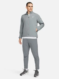 Брюки NIKE DRI-FIT UNLIMITED TAPERED LEG модель FB7548-084 Фото