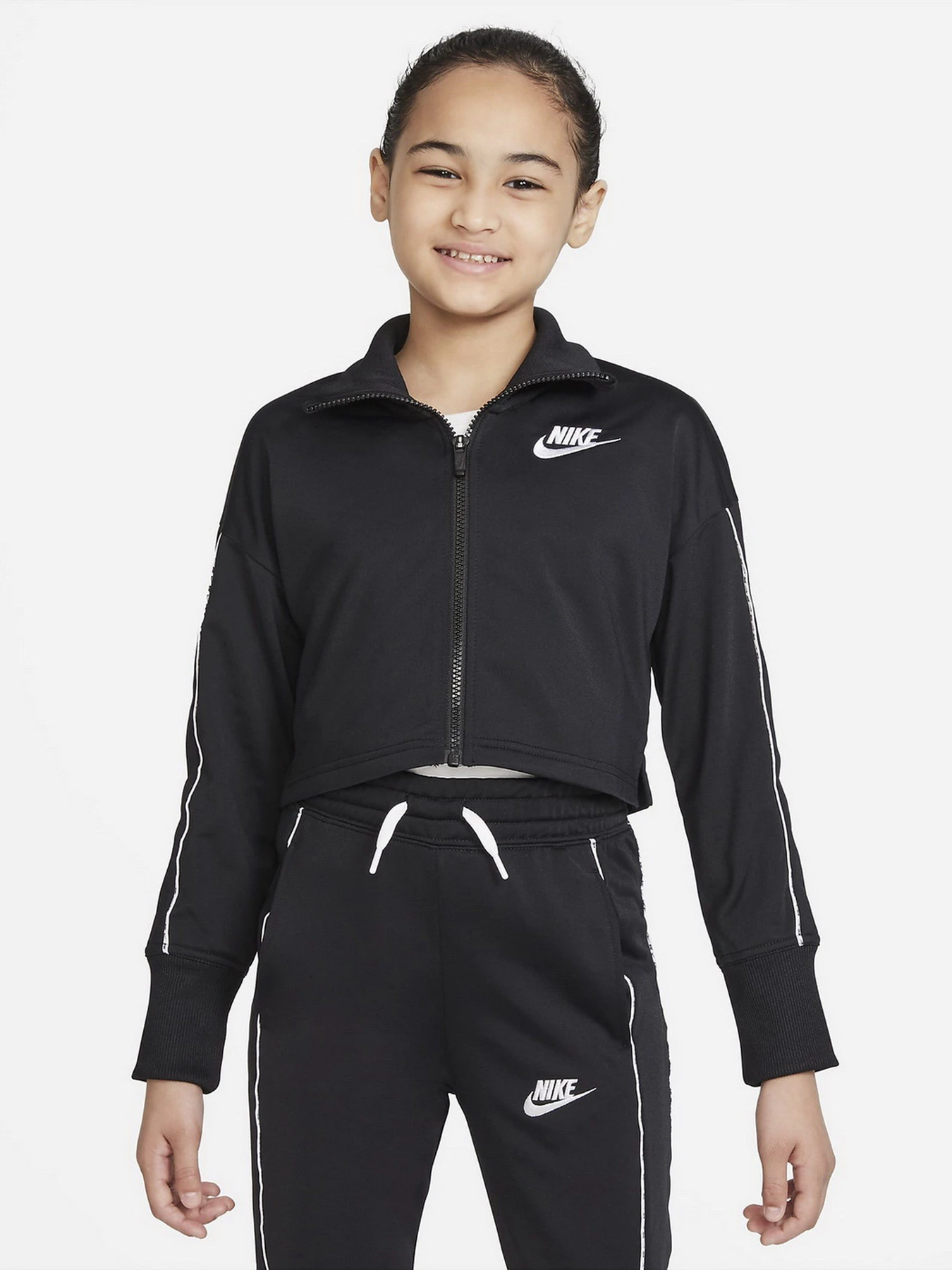 Костюмы NIKE G NSW TRK SUIT модель DD6302-010 Костюмы NIKE G NSW TRK SUIT модель DD6302-010 Фото