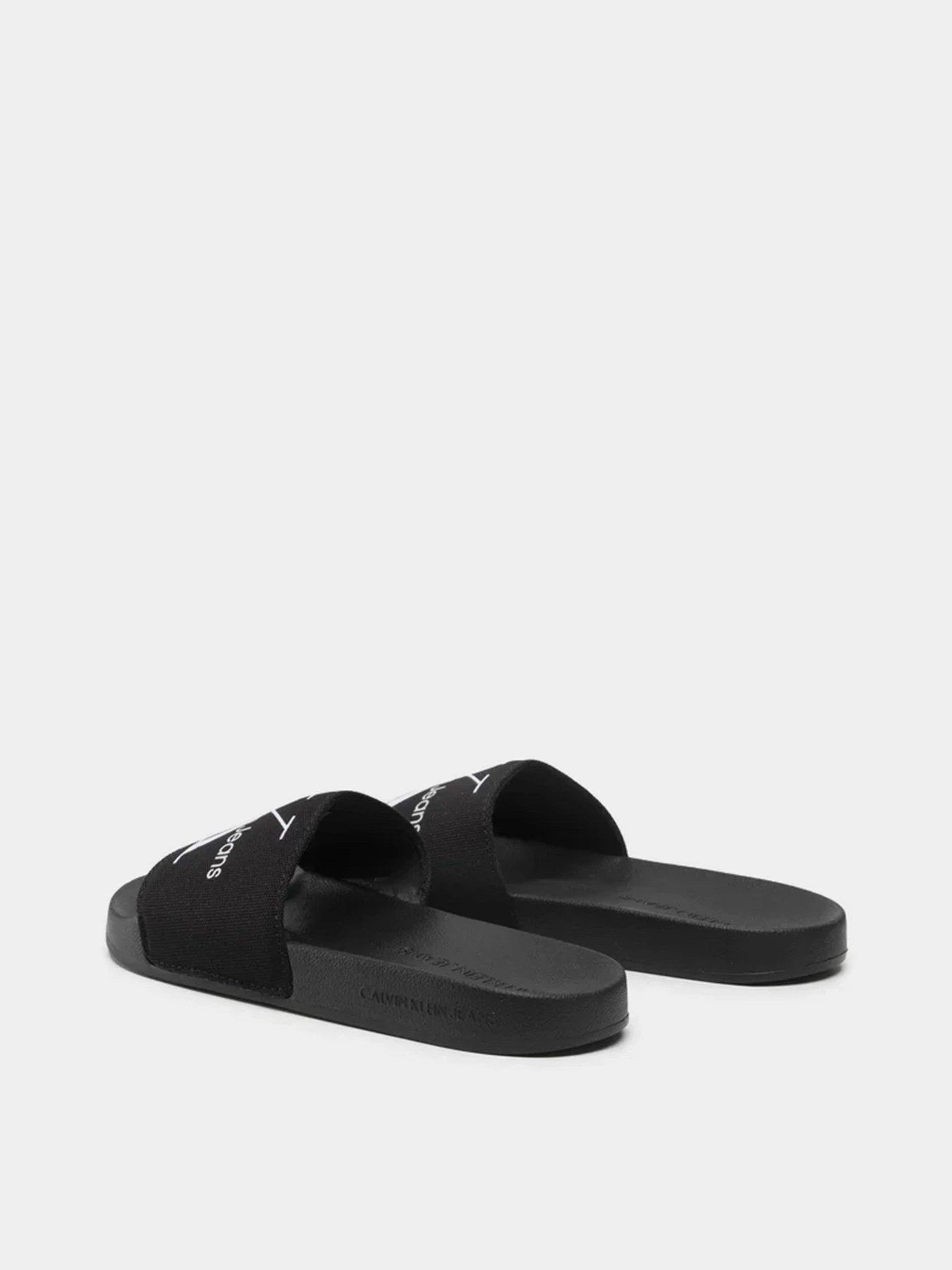 Шлёпанцы Calvin Klein Slide Monogram Co модель YW0YW00103-BDS Шлёпанцы Calvin Klein Slide Monogram Co модель YW0YW00103-BDS Фото