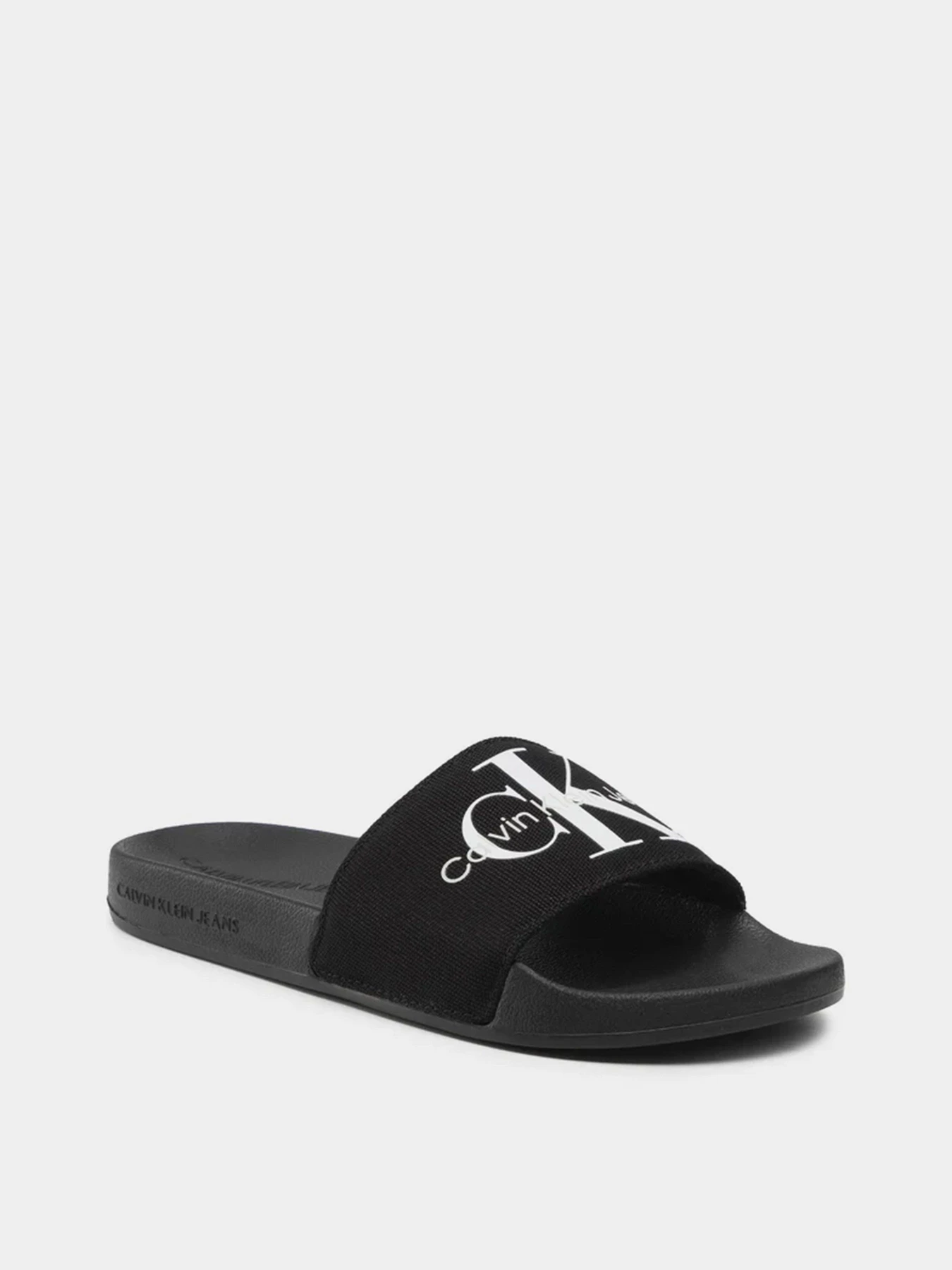 Шлёпанцы Calvin Klein Slide Monogram Co модель YW0YW00103-BDS Шлёпанцы Calvin Klein Slide Monogram Co модель YW0YW00103-BDS Фото