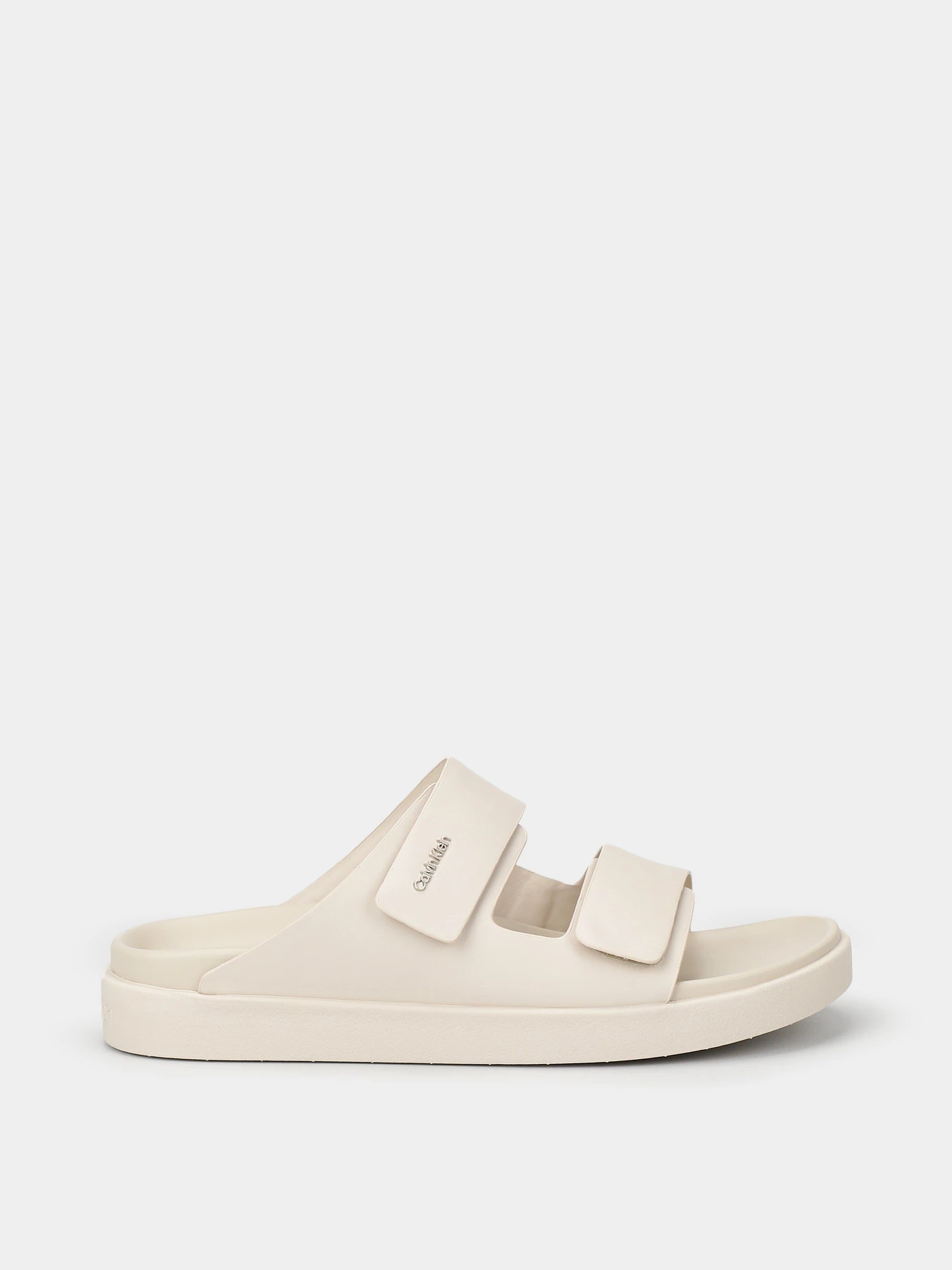 Шльопанці Calvin Klein Flat Adj Slide Calvin Mtl Lth модель HW0HW01954-ACE Фото