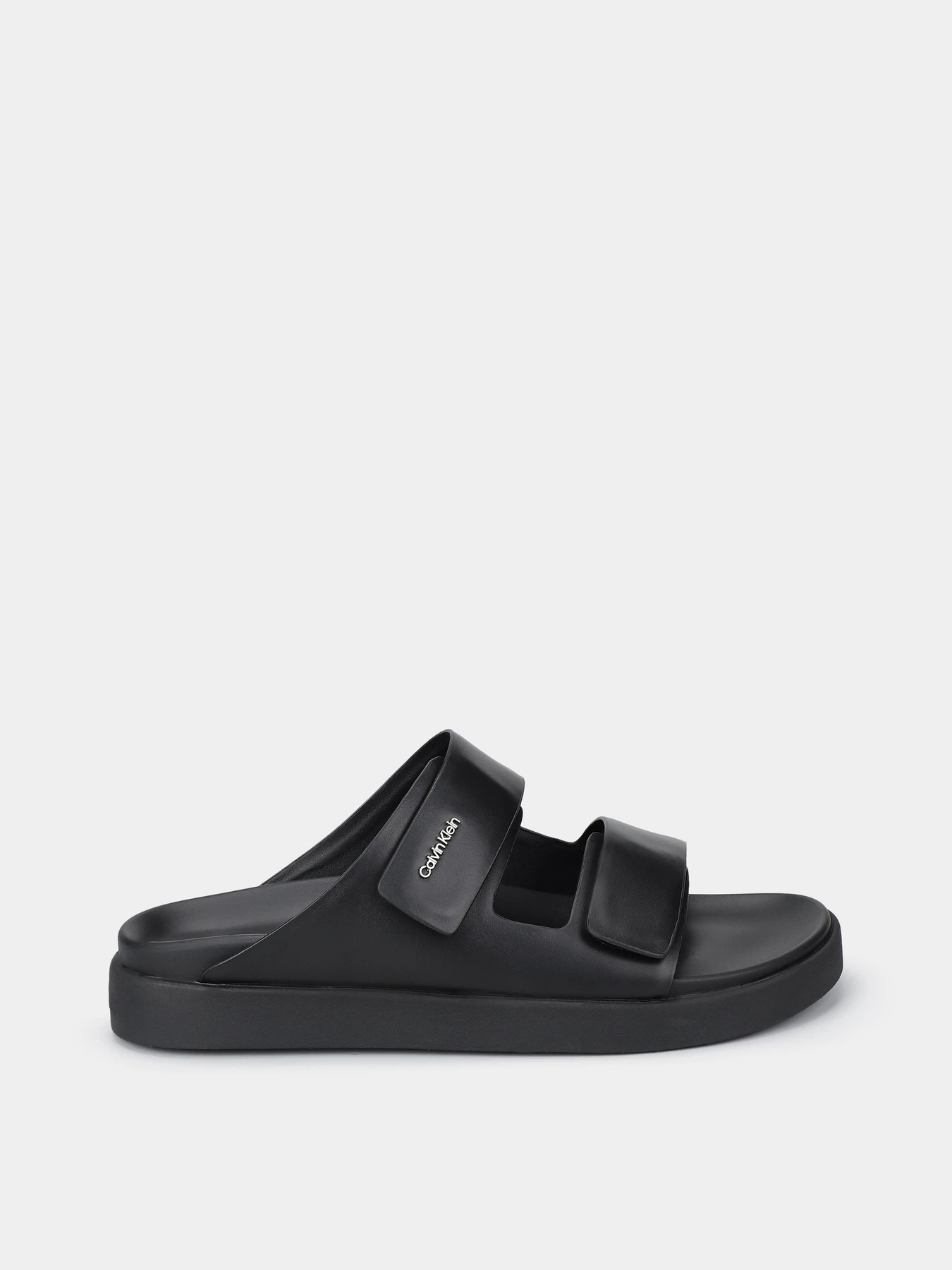 Шлёпанцы Calvin Klein Flat Adj Slide Calvin Mtl Lth модель HW0HW01954-BEH Шлёпанцы Calvin Klein Flat Adj Slide Calvin Mtl Lth модель HW0HW01954-BEH Фото