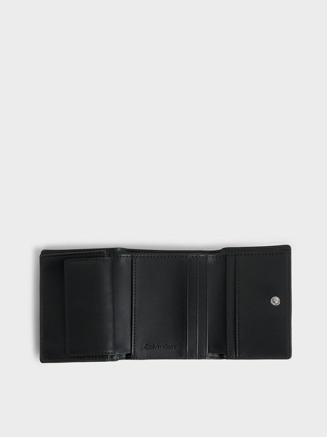 Гаманці Calvin Klein Re-Lock Trifold Xs Emb модель K60K611321-BAX Фото