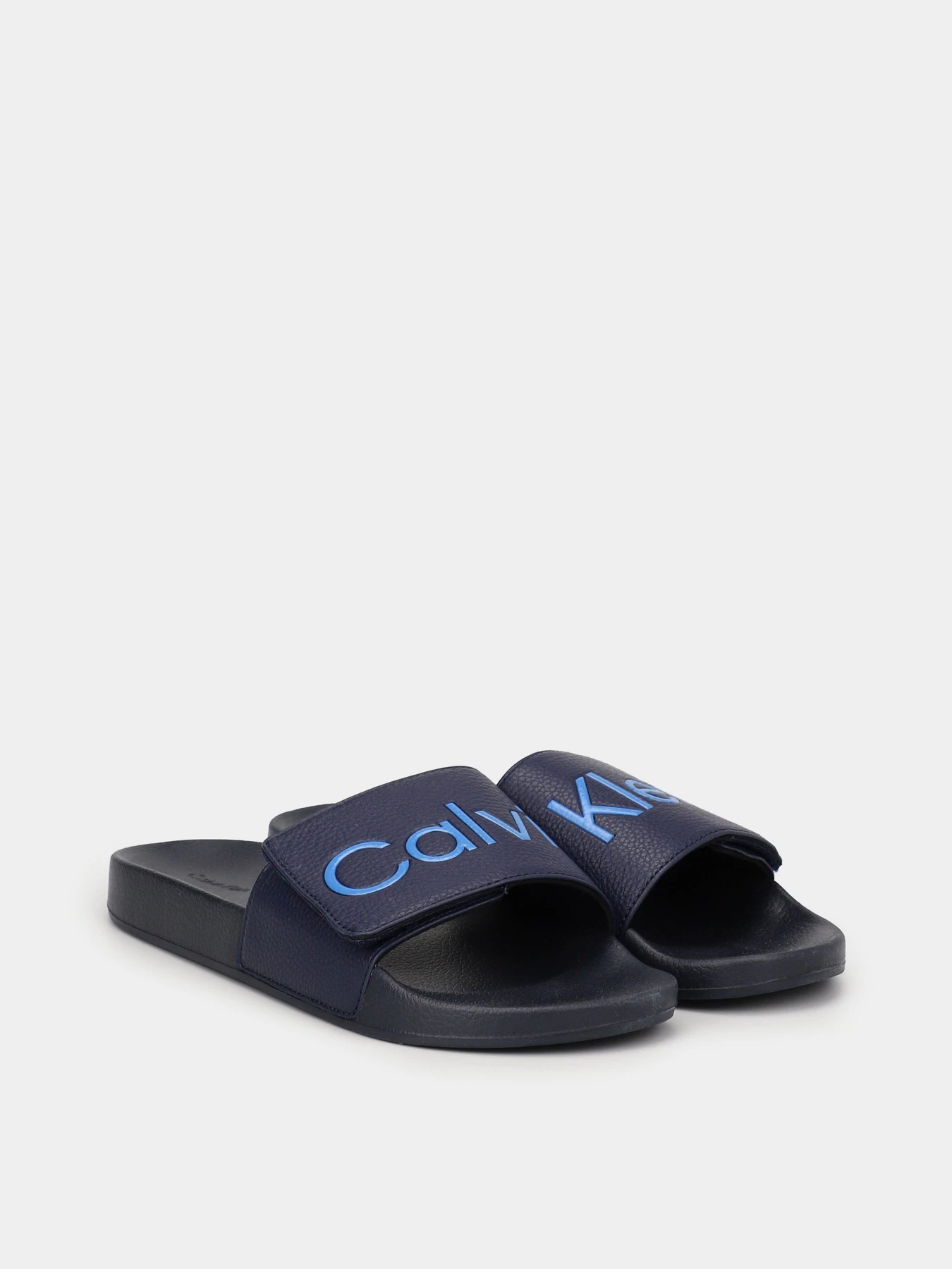 Шльопанці Calvin Klein Adj Pool Slide Pu модель HM0HM00957-DW4 Шльопанці Calvin Klein Adj Pool Slide Pu модель HM0HM00957-DW4 Фото