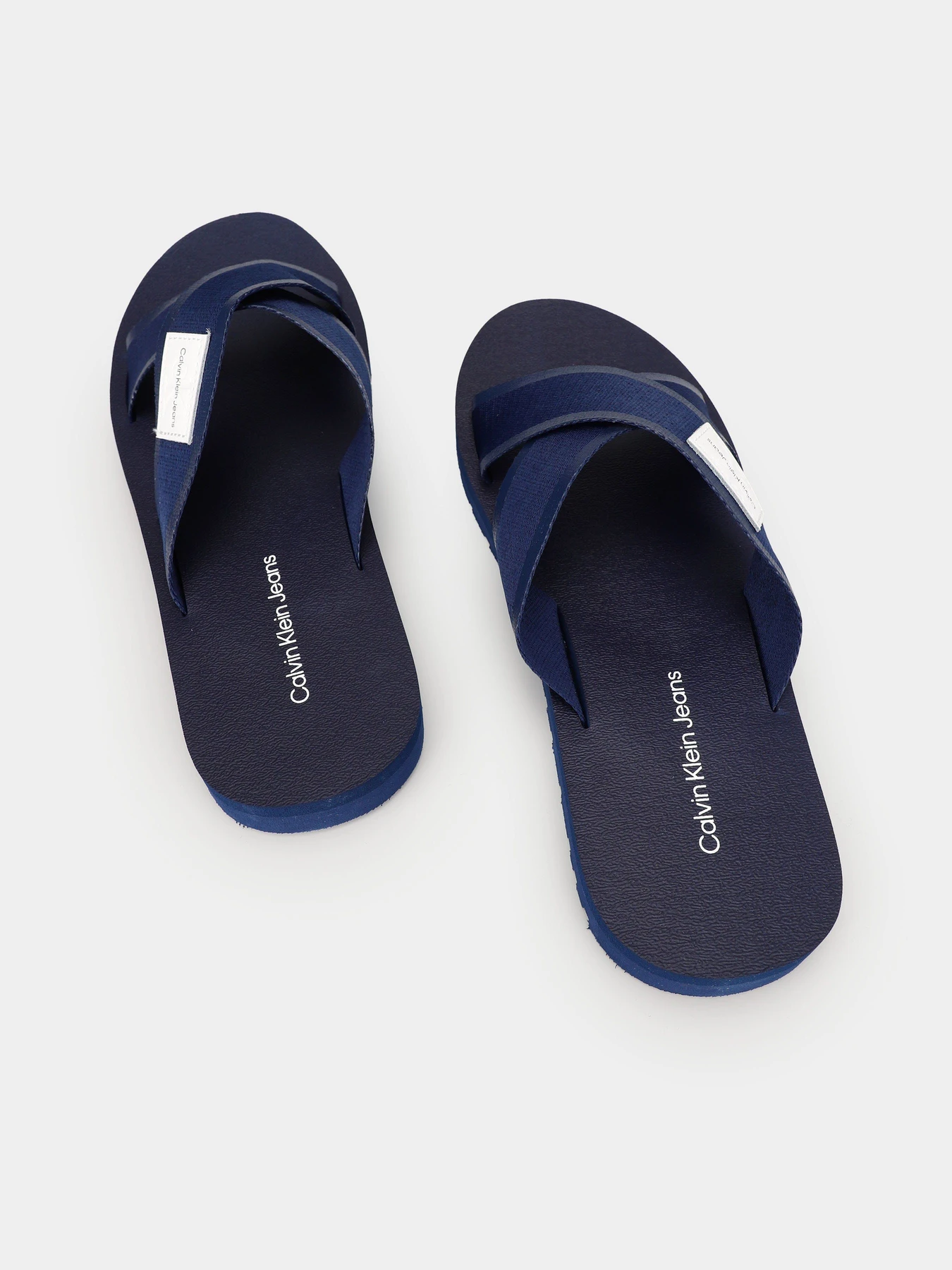 Шльопанці Calvin Klein Crisscros Badge модель YM0YM00641-C7I Шльопанці Calvin Klein Crisscros Badge модель YM0YM00641-C7I Фото