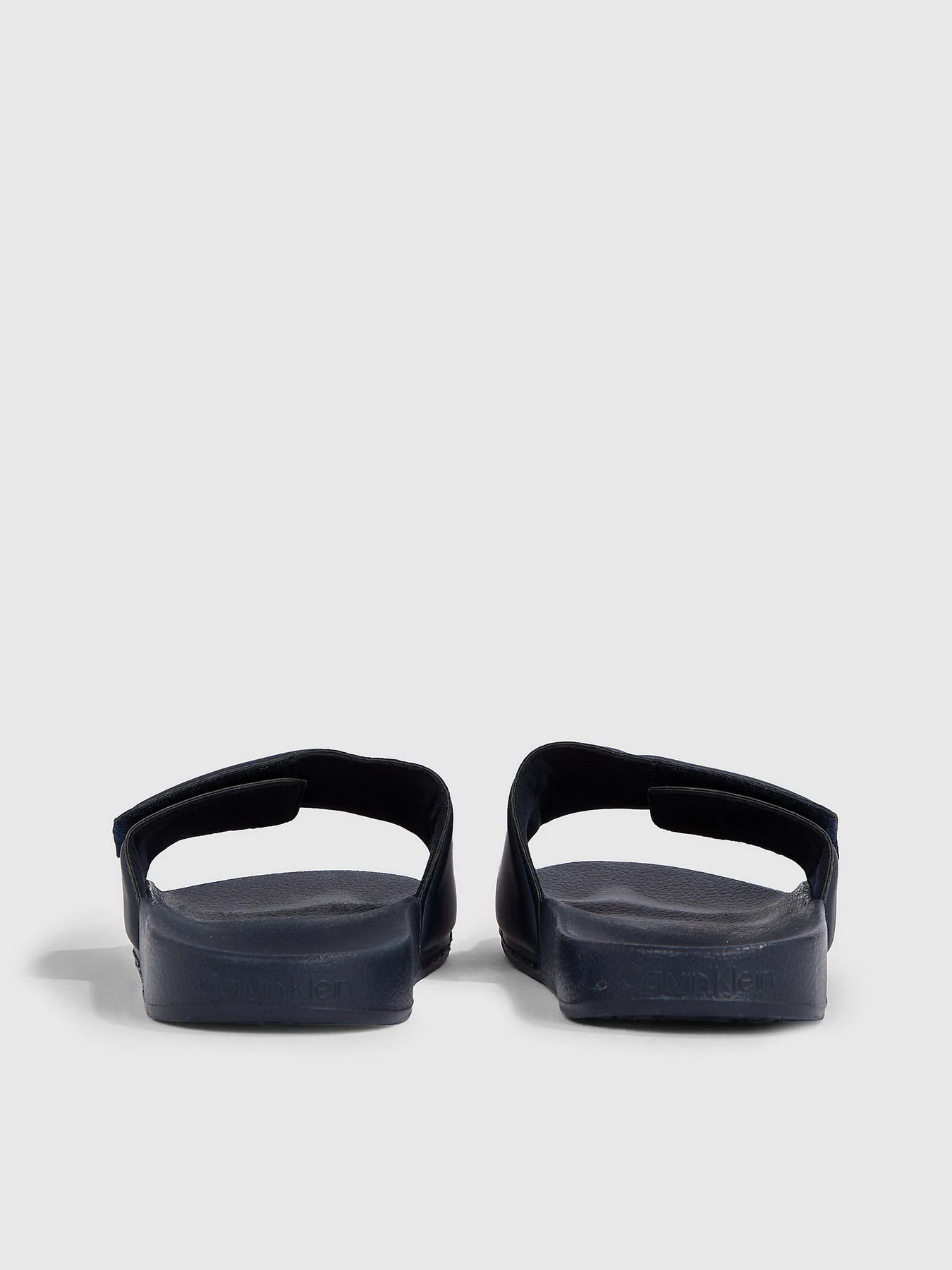 Шлёпанцы Calvin Klein Pool Slide Adj модель HM0HM01357-DW4 Шлёпанцы Calvin Klein Pool Slide Adj модель HM0HM01357-DW4 Фото
