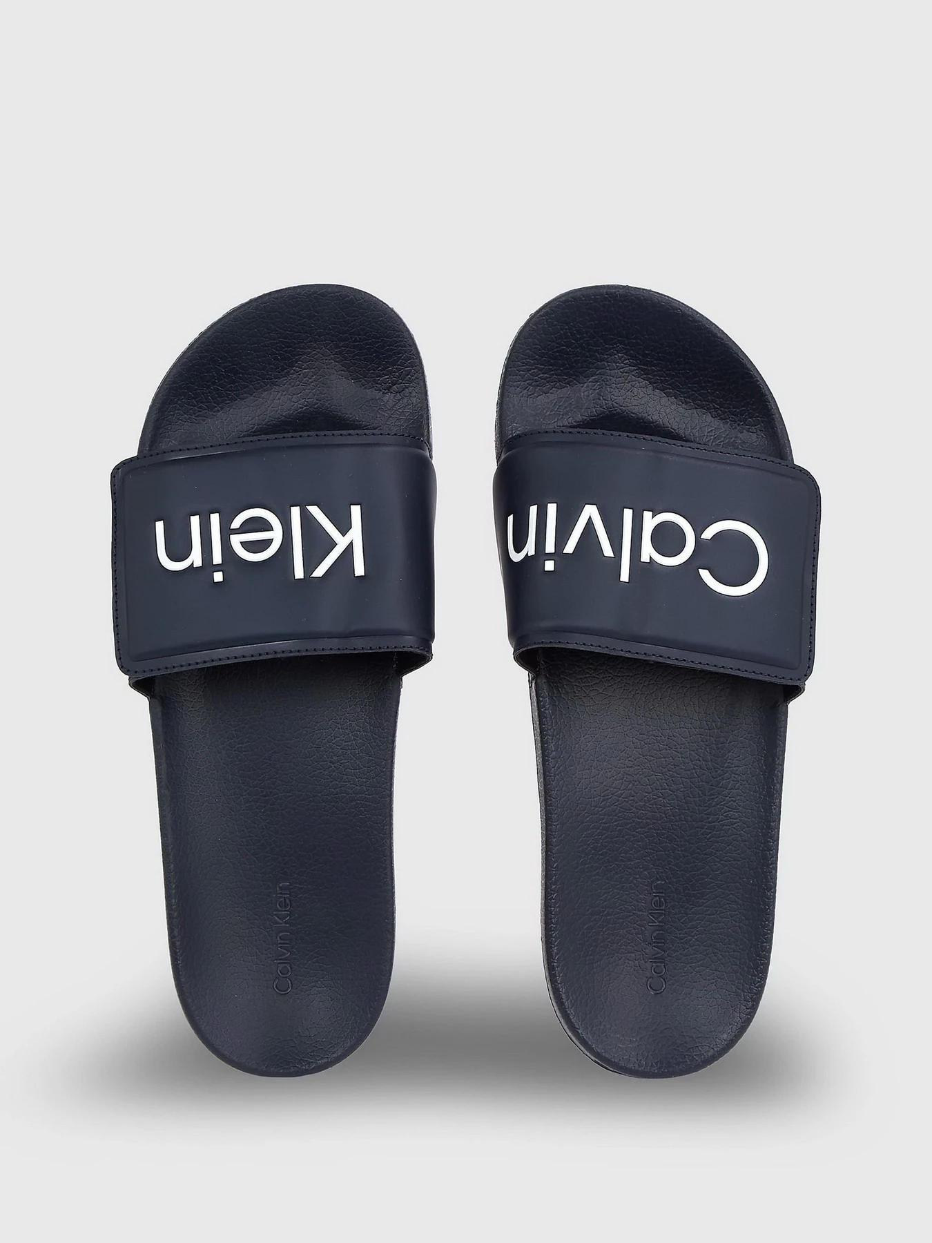 Шлёпанцы Calvin Klein Pool Slide Adj модель HM0HM01357-DW4 Шлёпанцы Calvin Klein Pool Slide Adj модель HM0HM01357-DW4 Фото