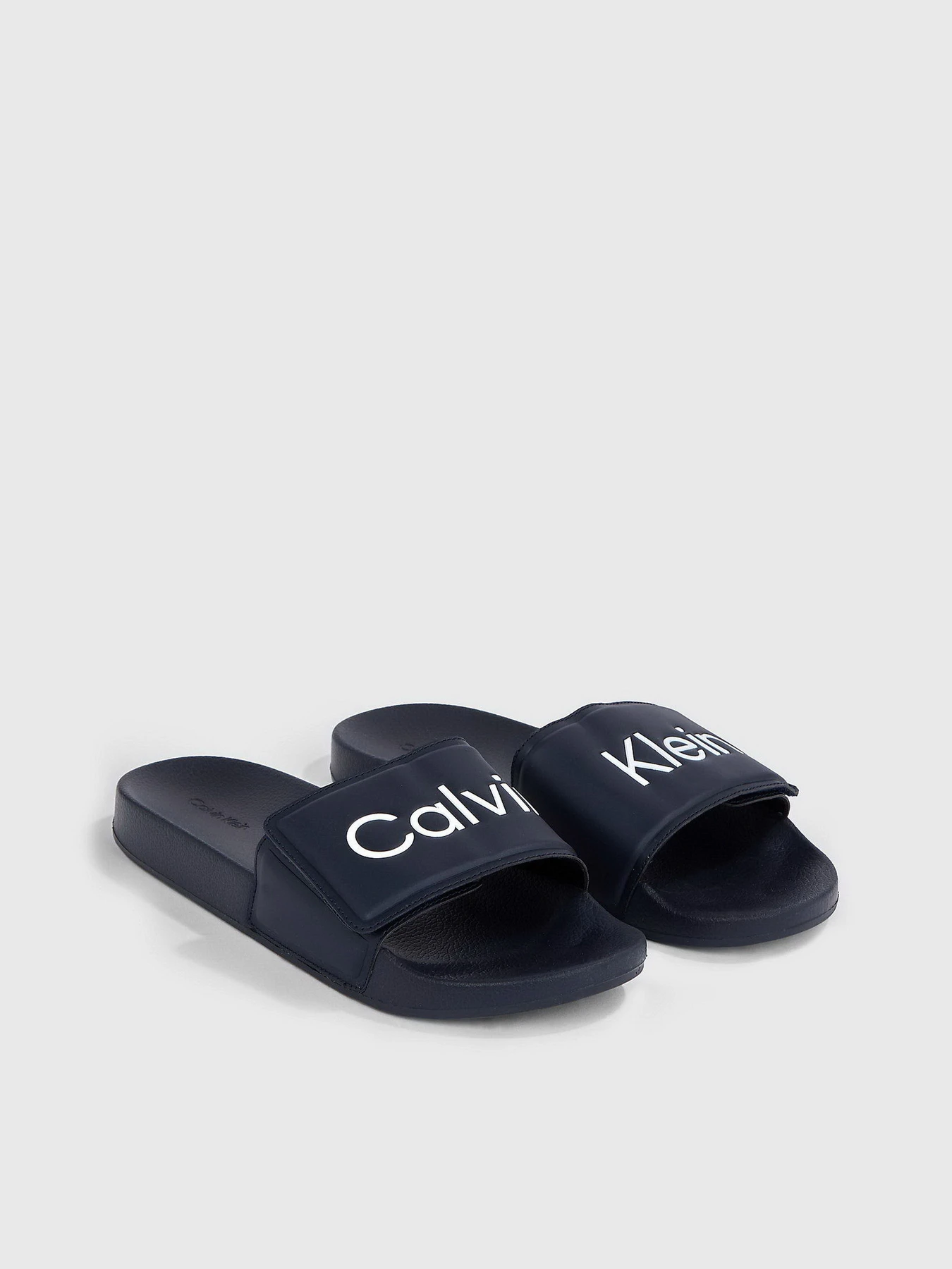 Шлёпанцы Calvin Klein Pool Slide Adj модель HM0HM01357-DW4 Шлёпанцы Calvin Klein Pool Slide Adj модель HM0HM01357-DW4 Фото
