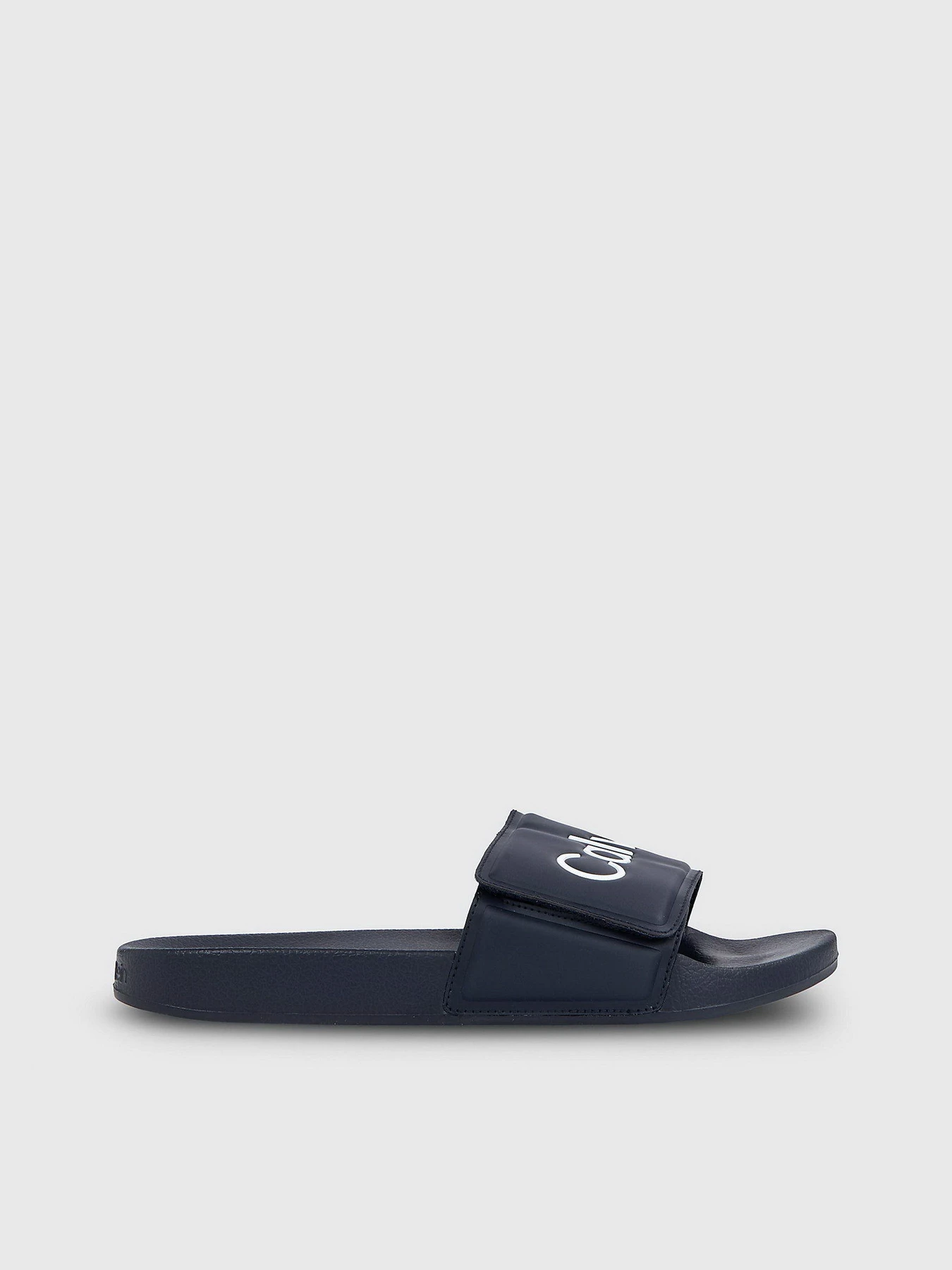 Шлёпанцы Calvin Klein Pool Slide Adj модель HM0HM01357-DW4 Шлёпанцы Calvin Klein Pool Slide Adj модель HM0HM01357-DW4 Фото