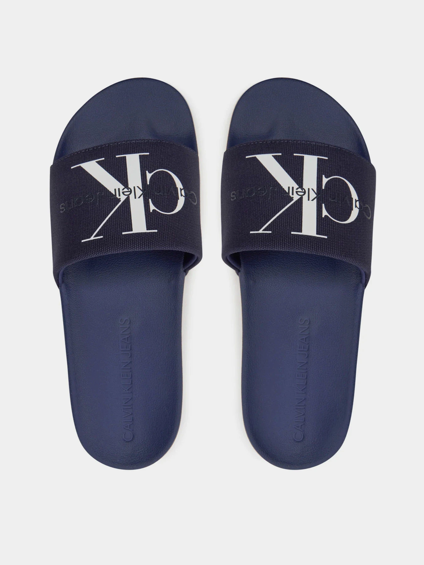 Шльопанці Calvin Klein Slide Monogram Co модель YM0YM00061-0G2 Фото