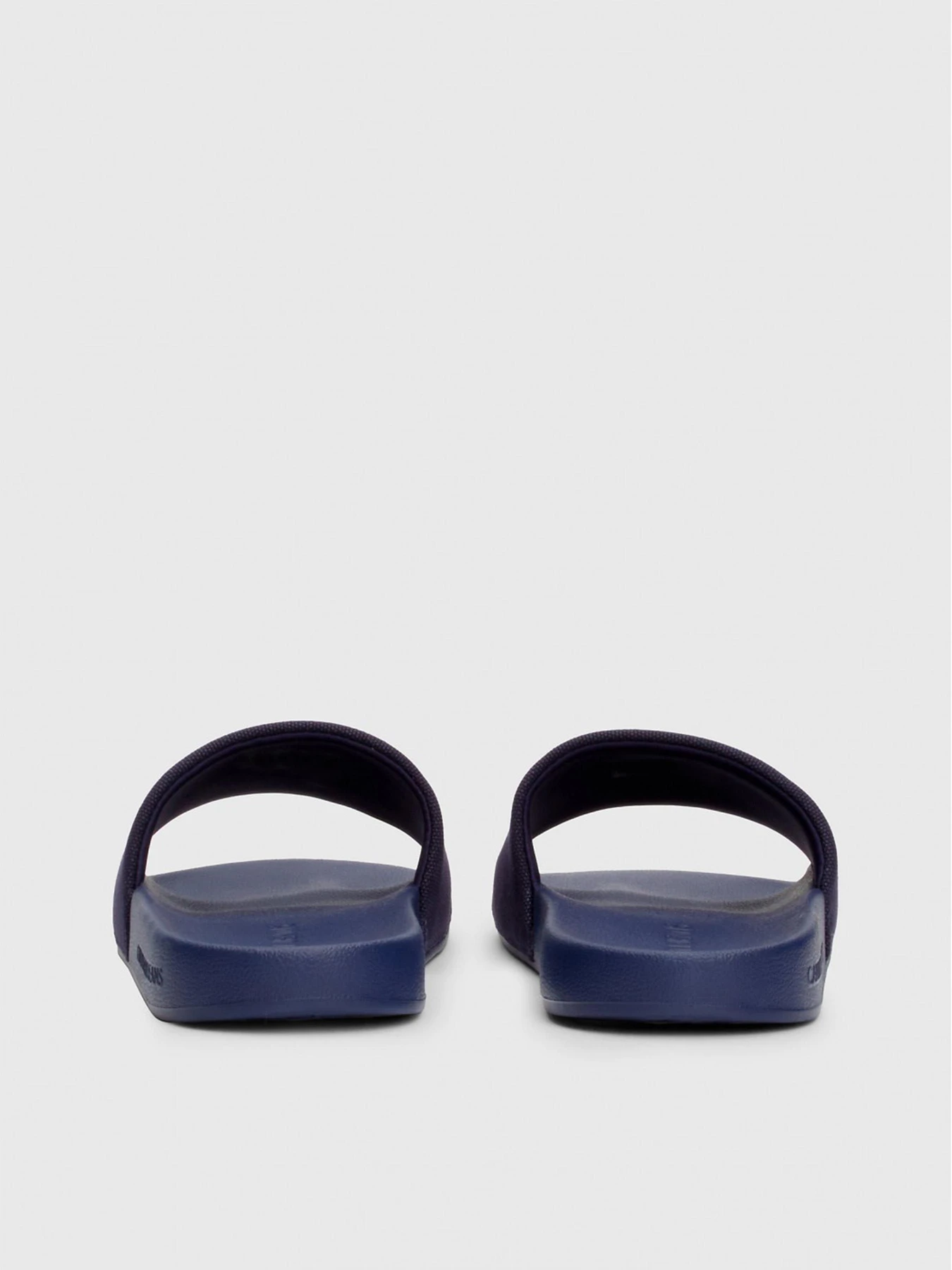 Шльопанці Calvin Klein Slide Monogram Co модель YM0YM00061-0GY Фото