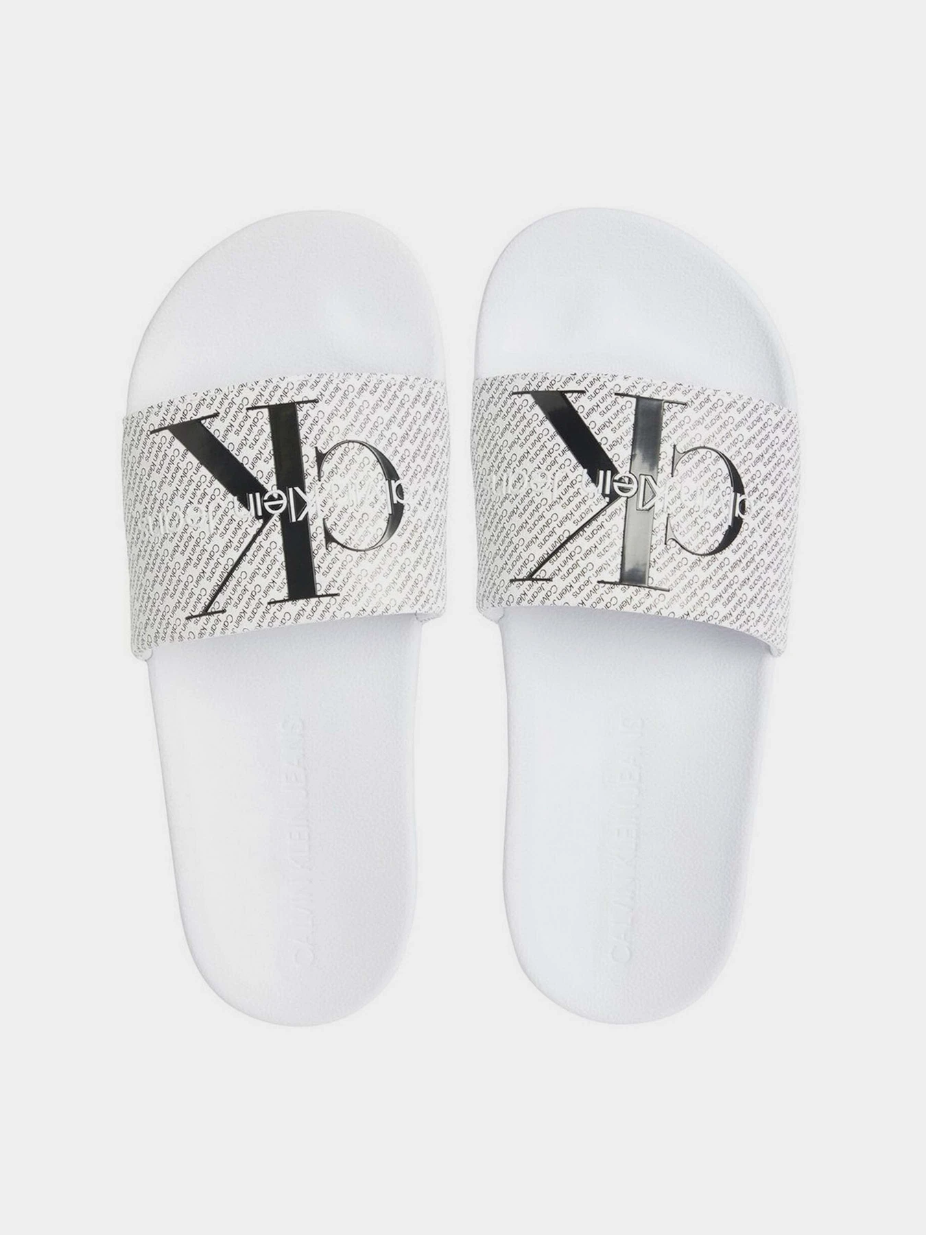 Шльопанці Calvin Klein Slide Aop модель YM0YM00955-01W Шльопанці Calvin Klein Slide Aop модель YM0YM00955-01W Фото