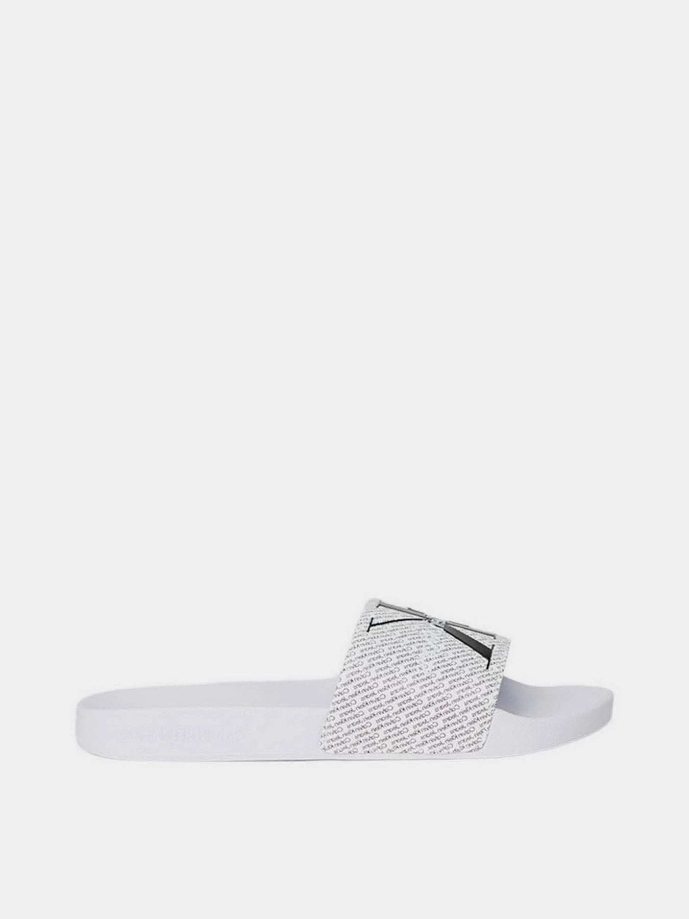 Шльопанці Calvin Klein Slide Aop модель YM0YM00955-01W Шльопанці Calvin Klein Slide Aop модель YM0YM00955-01W Фото