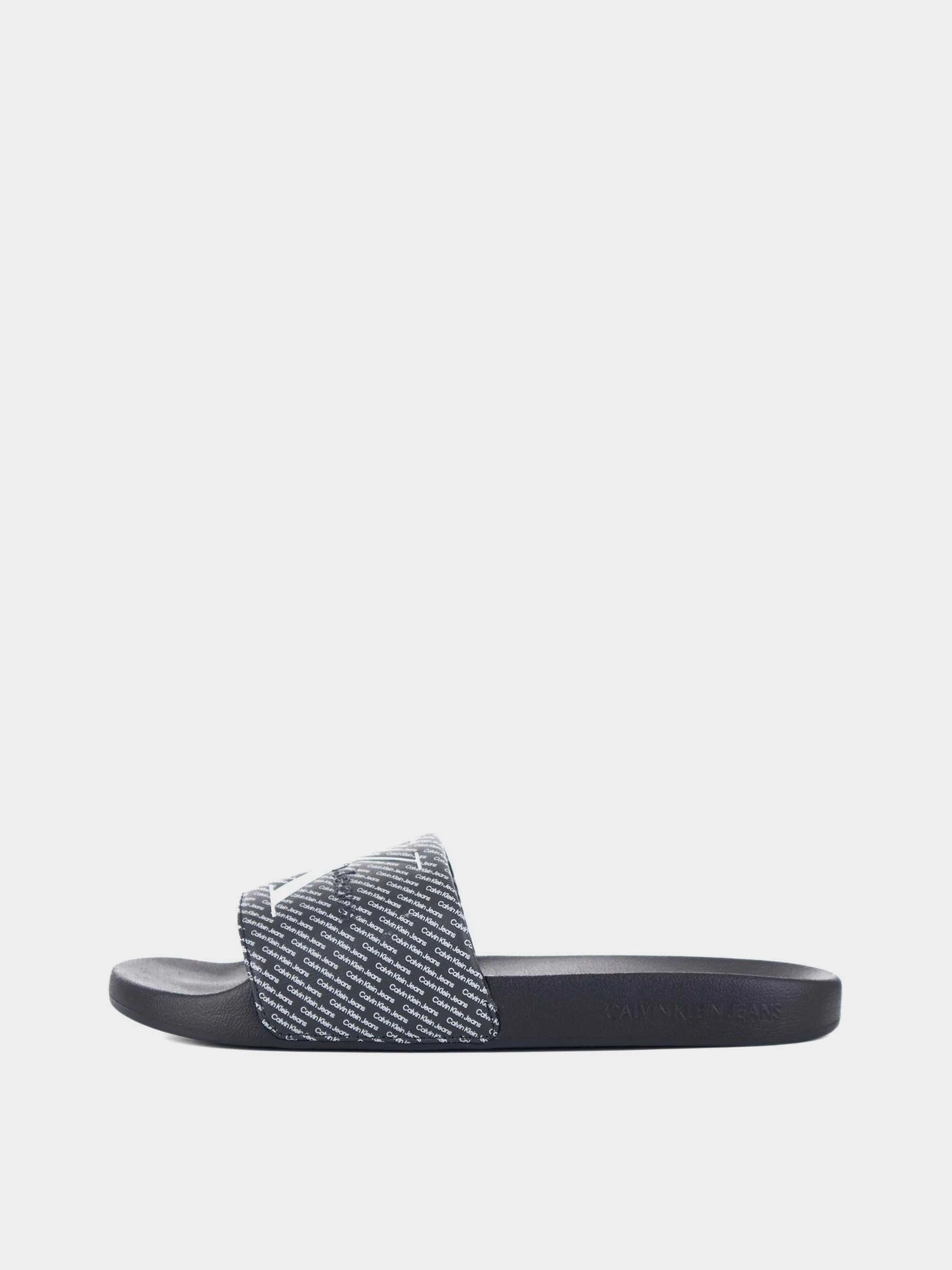 Шльопанці Calvin Klein Slide Aop модель YM0YM00955-0GM Шльопанці Calvin Klein Slide Aop модель YM0YM00955-0GM Фото