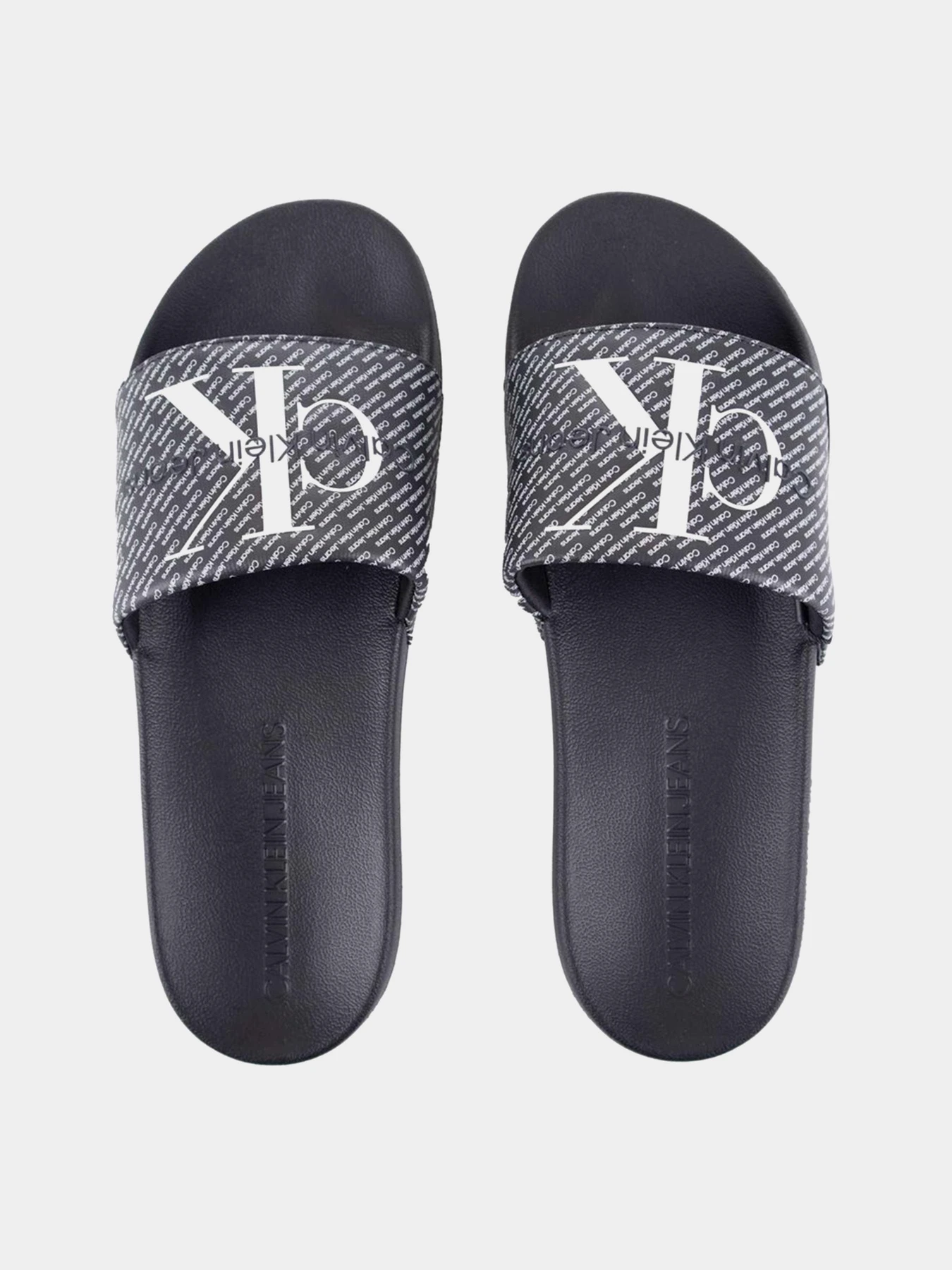 Шльопанці Calvin Klein Slide Aop модель YM0YM00955-0GM Шльопанці Calvin Klein Slide Aop модель YM0YM00955-0GM Фото