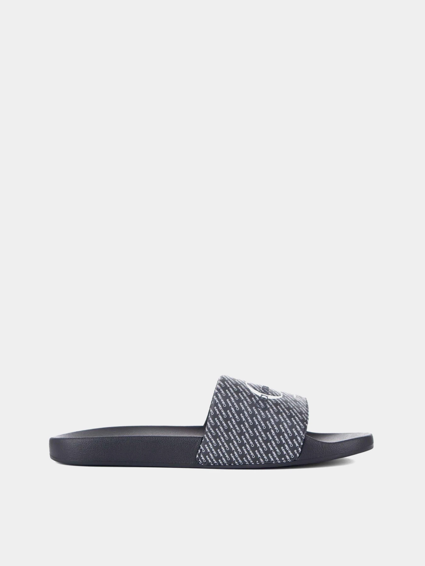 Шльопанці Calvin Klein Slide Aop модель YM0YM00955-0GM Шльопанці Calvin Klein Slide Aop модель YM0YM00955-0GM Фото