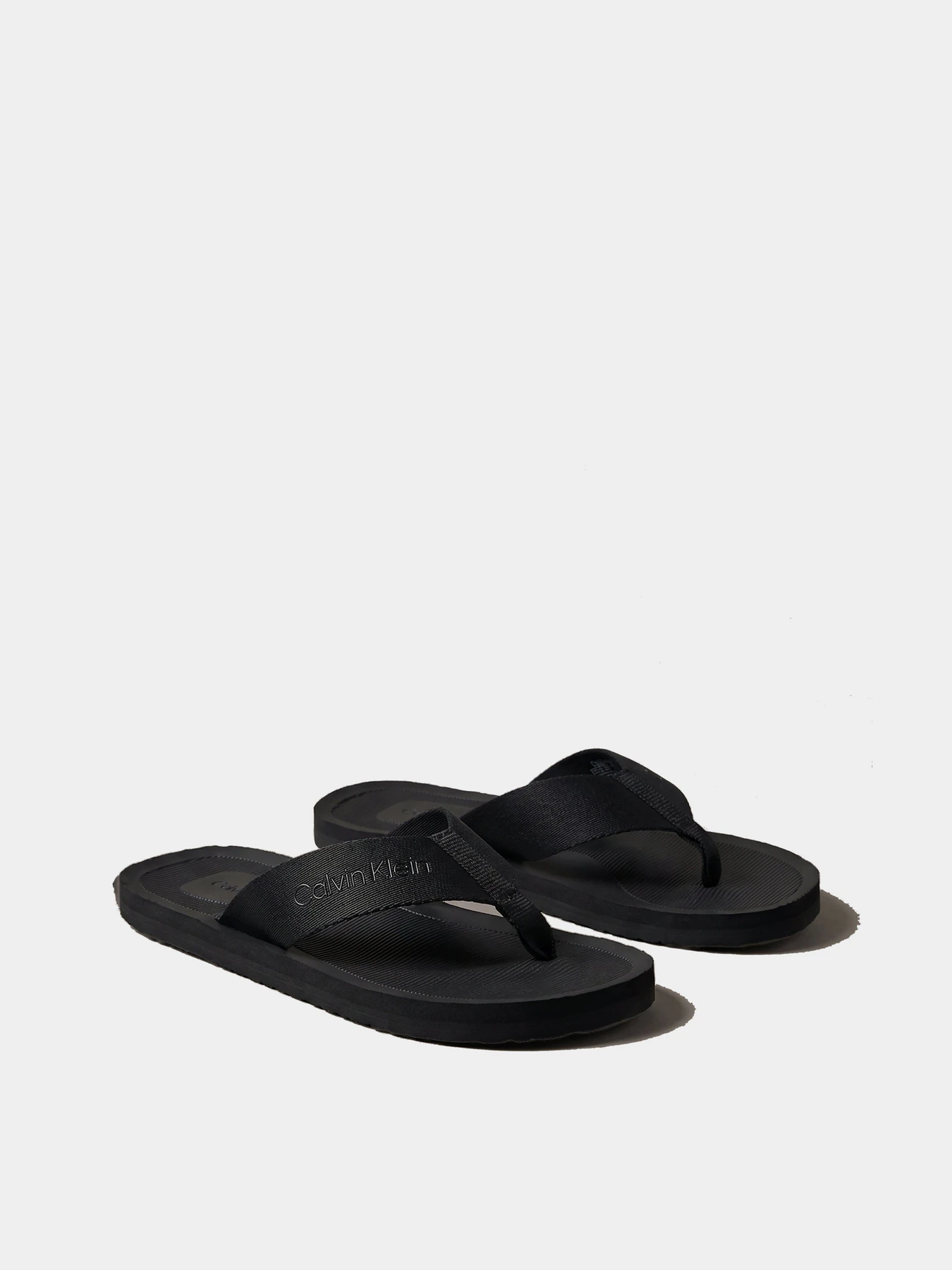 Шльопанці Calvin Klein CITY THONG SLIDE модель HM0HM02106-0GJ Шльопанці Calvin Klein CITY THONG SLIDE модель HM0HM02106-0GJ Фото