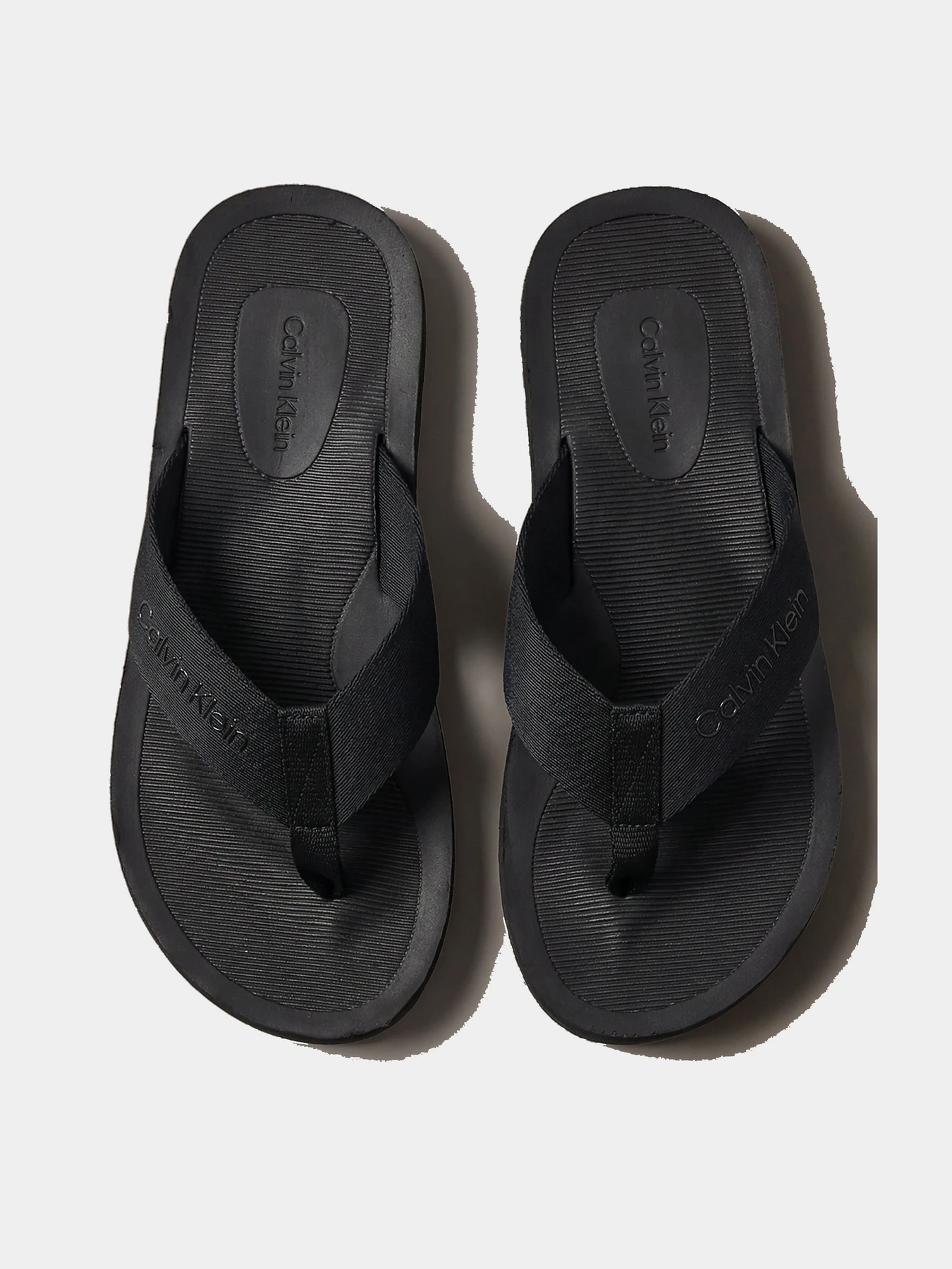 Шльопанці Calvin Klein CITY THONG SLIDE модель HM0HM02106-0GJ Шльопанці Calvin Klein CITY THONG SLIDE модель HM0HM02106-0GJ Фото