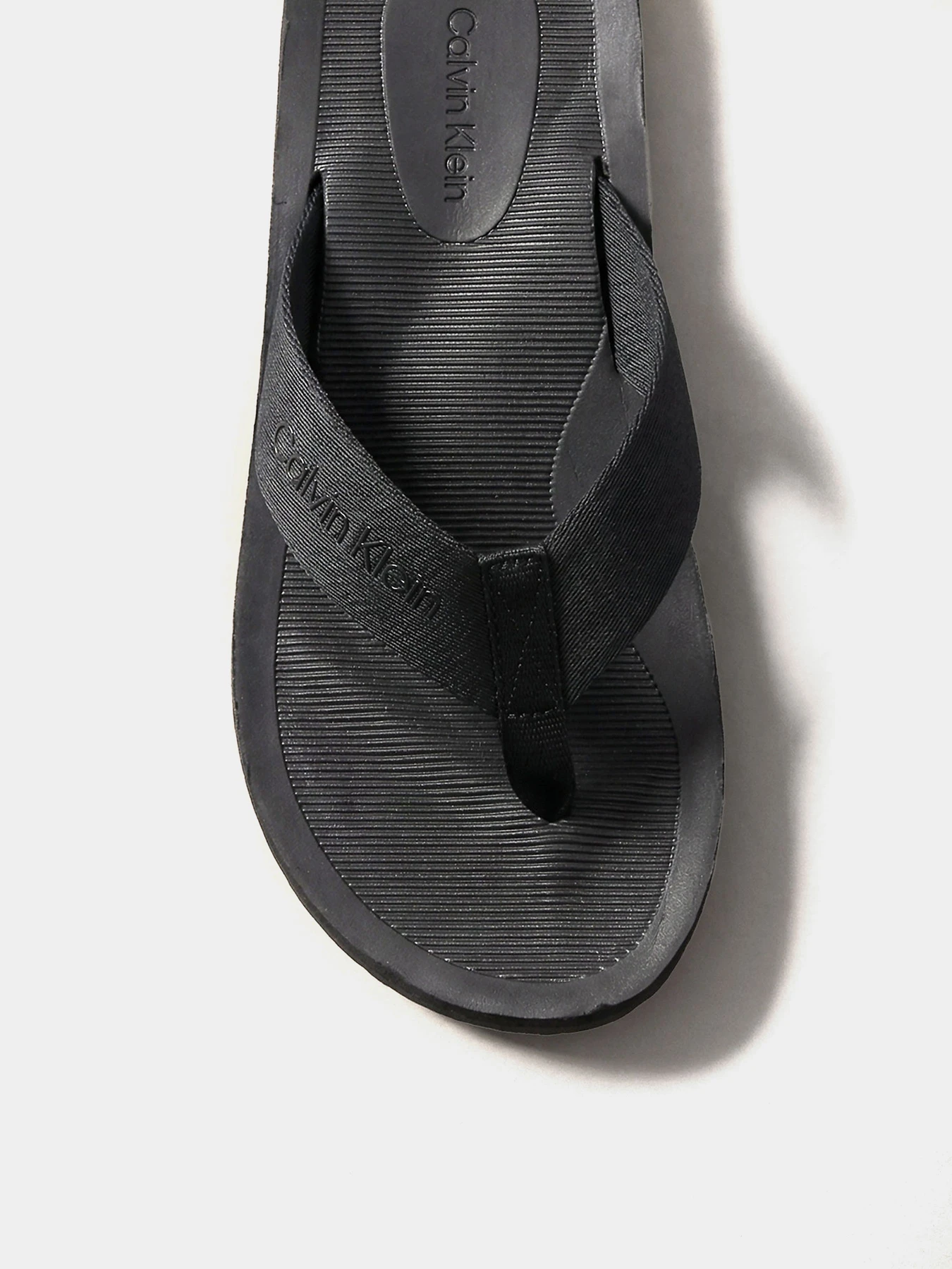 Шльопанці Calvin Klein CITY THONG SLIDE модель HM0HM02106-0GJ Шльопанці Calvin Klein CITY THONG SLIDE модель HM0HM02106-0GJ Фото