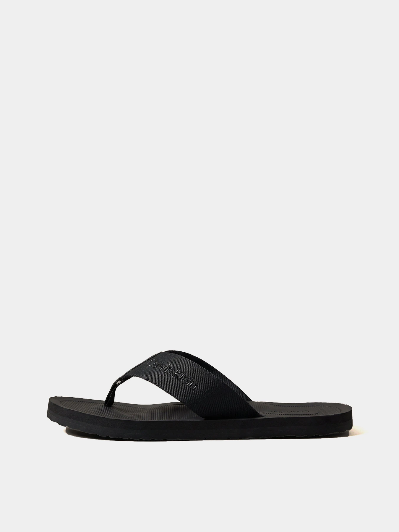 Шльопанці Calvin Klein CITY THONG SLIDE модель HM0HM02106-0GJ Шльопанці Calvin Klein CITY THONG SLIDE модель HM0HM02106-0GJ Фото