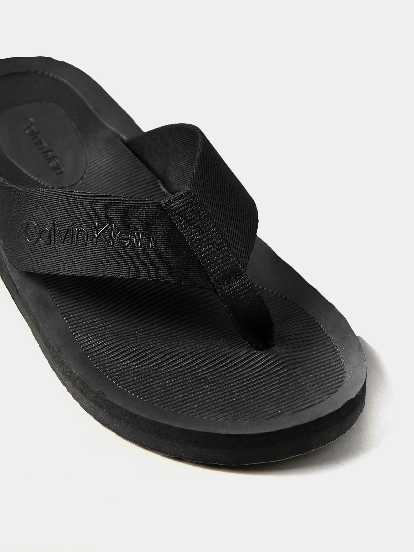 Шльопанці Calvin Klein CITY THONG SLIDE модель HM0HM02106-0GJ Шльопанці Calvin Klein CITY THONG SLIDE модель HM0HM02106-0GJ Фото