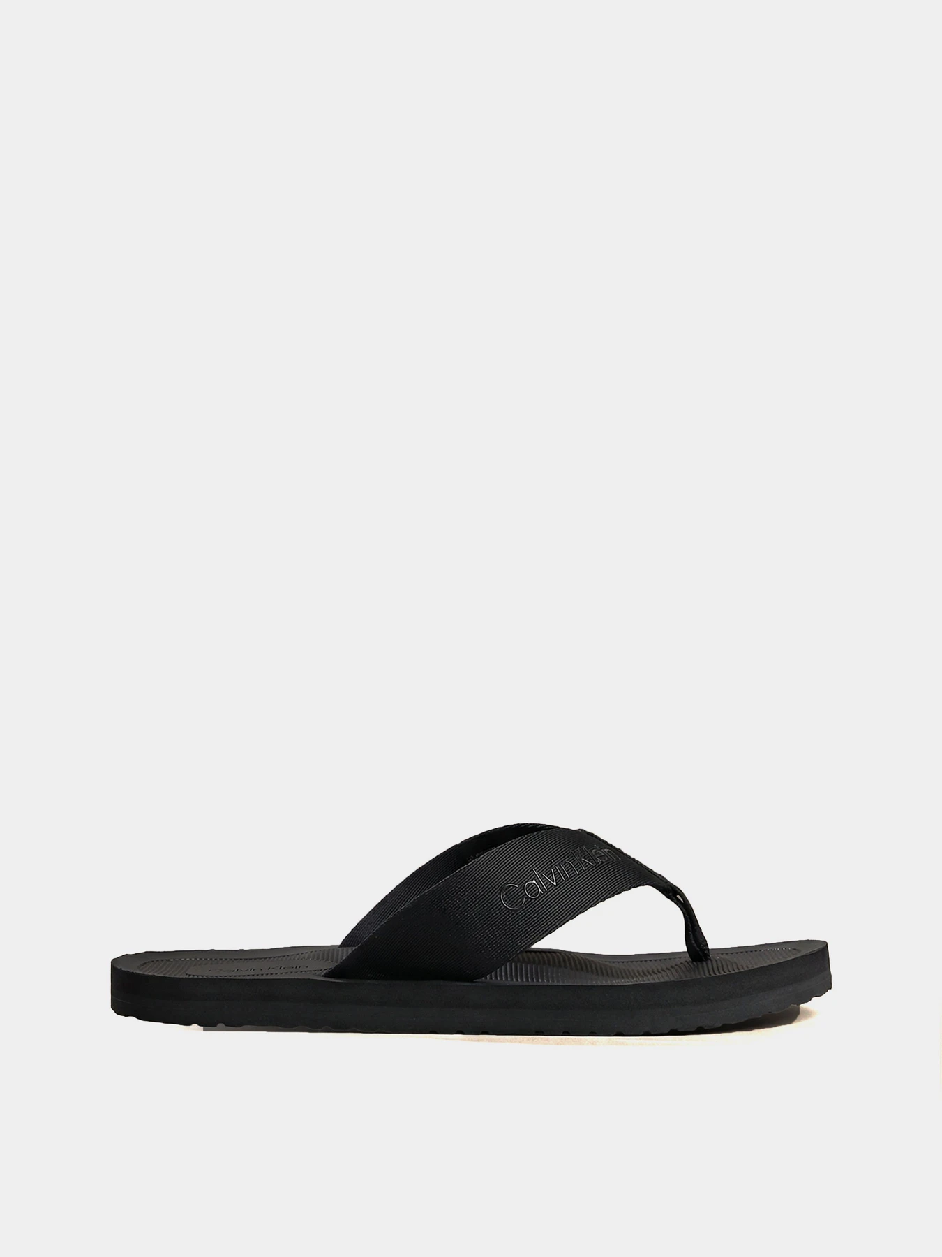 Шльопанці Calvin Klein CITY THONG SLIDE модель HM0HM02106-0GJ Шльопанці Calvin Klein CITY THONG SLIDE модель HM0HM02106-0GJ Фото
