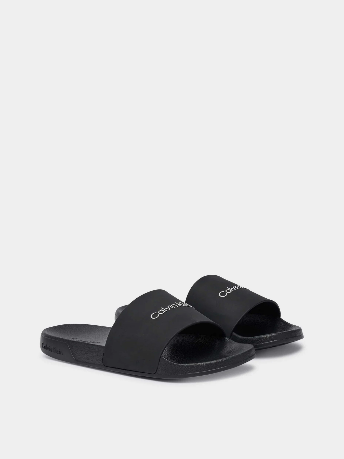 Шлёпанцы Calvin Klein ESS SLIDE MONOBRAND CV модель HM0HM02107-0GJ Шлёпанцы Calvin Klein ESS SLIDE MONOBRAND CV модель HM0HM02107-0GJ Фото