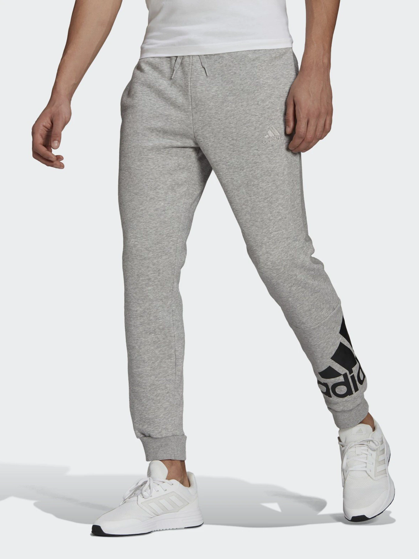 Брюки Adidas ESSENTIALS FLEECE TAPERED CUFF LOGO модель GK8969 Фото