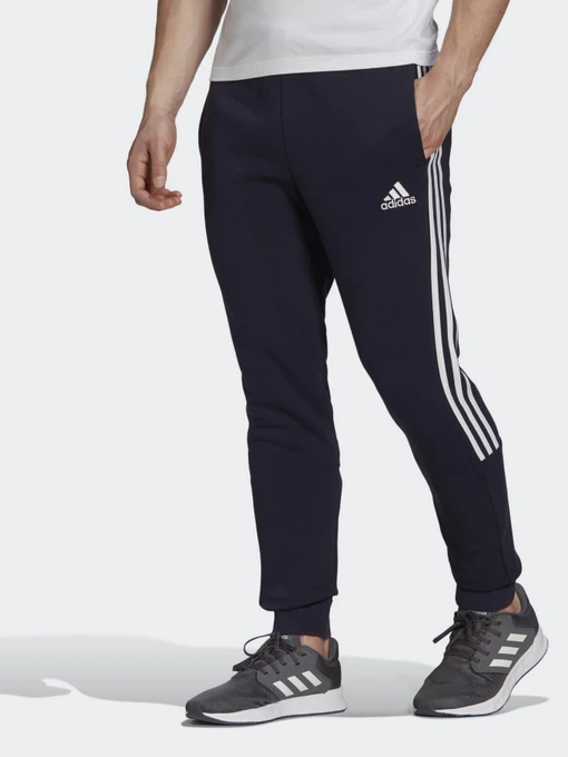 Брюки Adidas ESSENTIALS FLEECE TAPERED CUFF 3-STRIPES модель GK8977 Фото