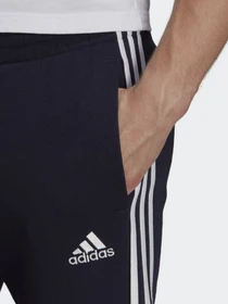 Брюки Adidas ESSENTIALS FLEECE TAPERED CUFF 3-STRIPES модель GK8977 Фото