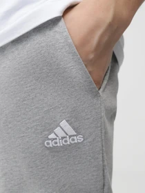Брюки Adidas ESSENTIALS JERSEY TAPERED модель IC9411 Фото