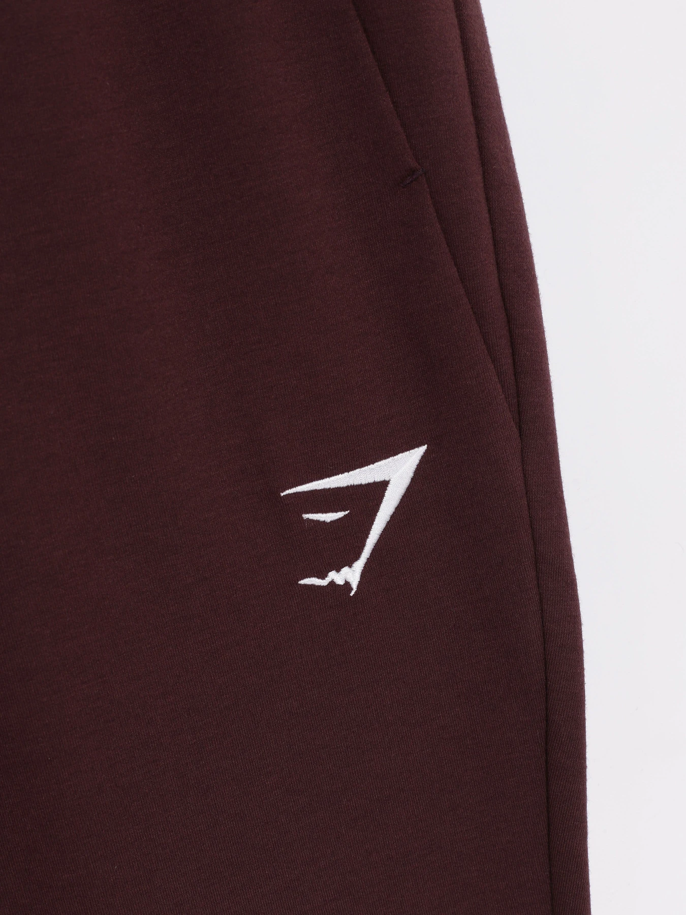 Штани Gymshark модель GMBT3252_т.бордовий Штани Gymshark модель GMBT3252_т.бордовий Фото