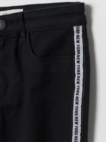 Брюки H&M модель 0772344_чорний з білим Фото
