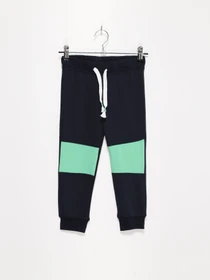 Брюки H&M модель 0936549_т.синій з зеленим Фото