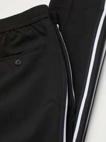 Брюки H&M модель 0942609_чорний з білим Фото