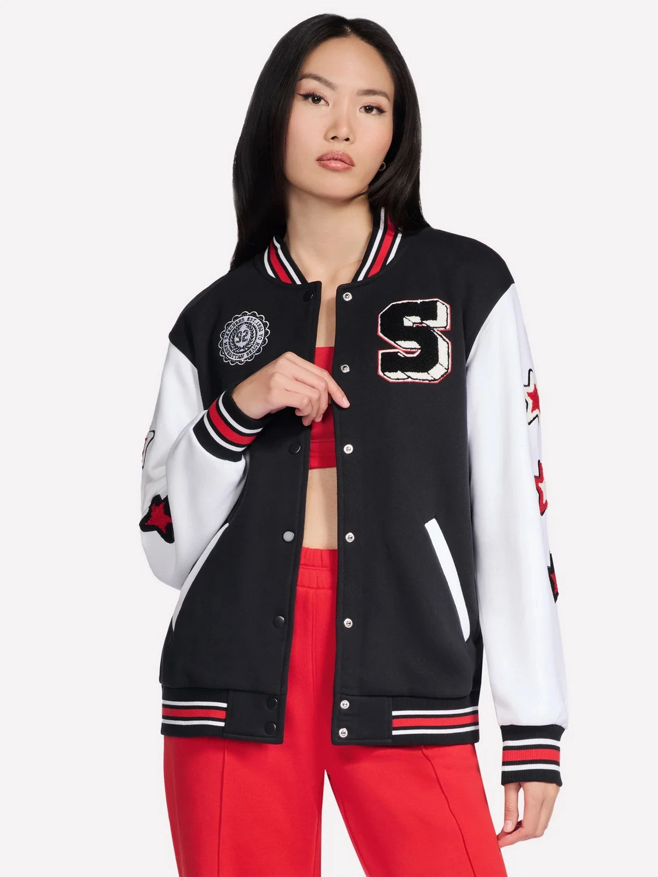 Куртки и дубленки Skechers SKECHERS CLASSIC VARSITY JACKE модель JA291 BLK Фото