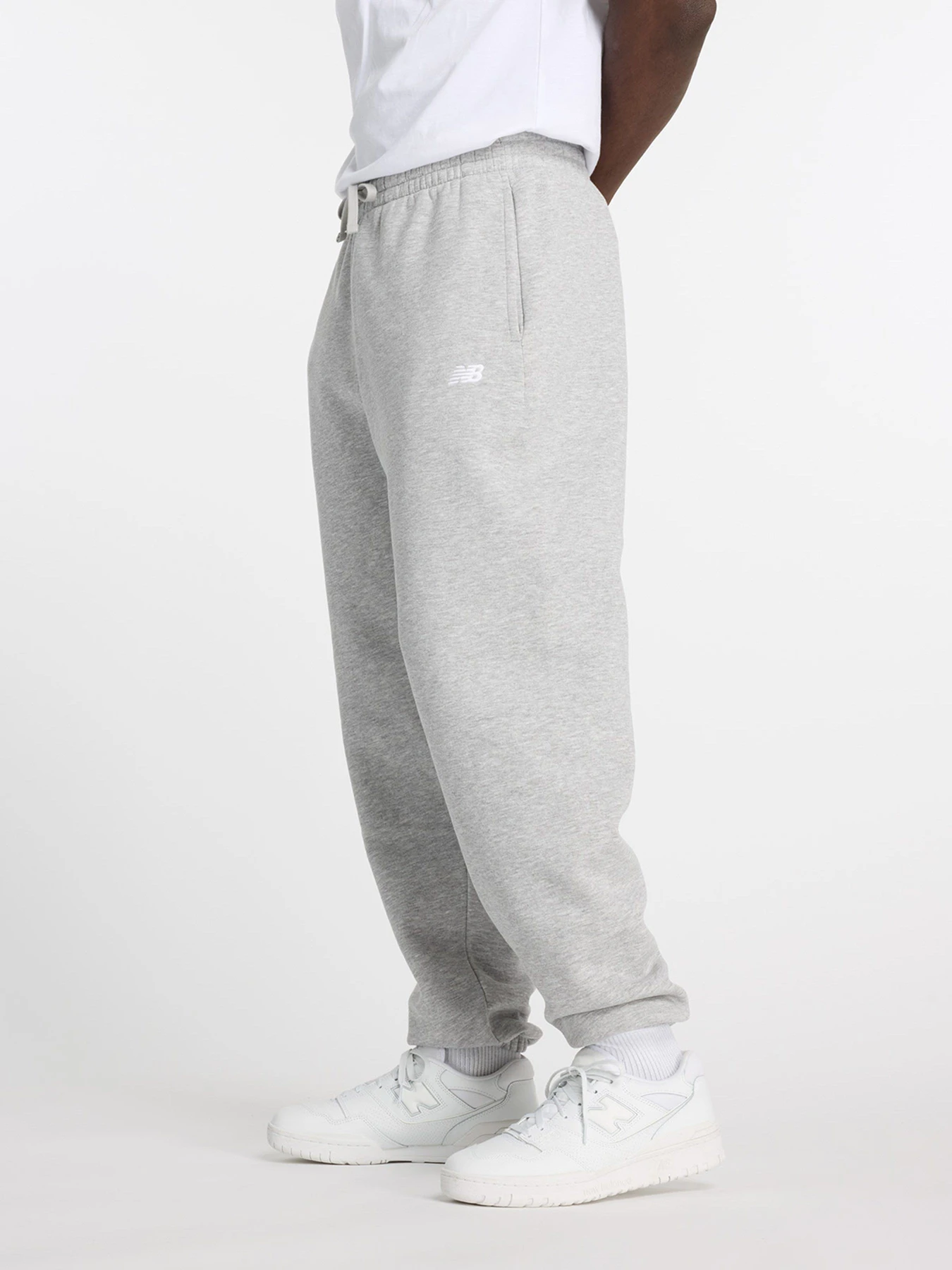 Брюки New Balance SPORT ESSENTIALS FLEECE модель MP41503AG Брюки New Balance SPORT ESSENTIALS FLEECE модель MP41503AG Фото