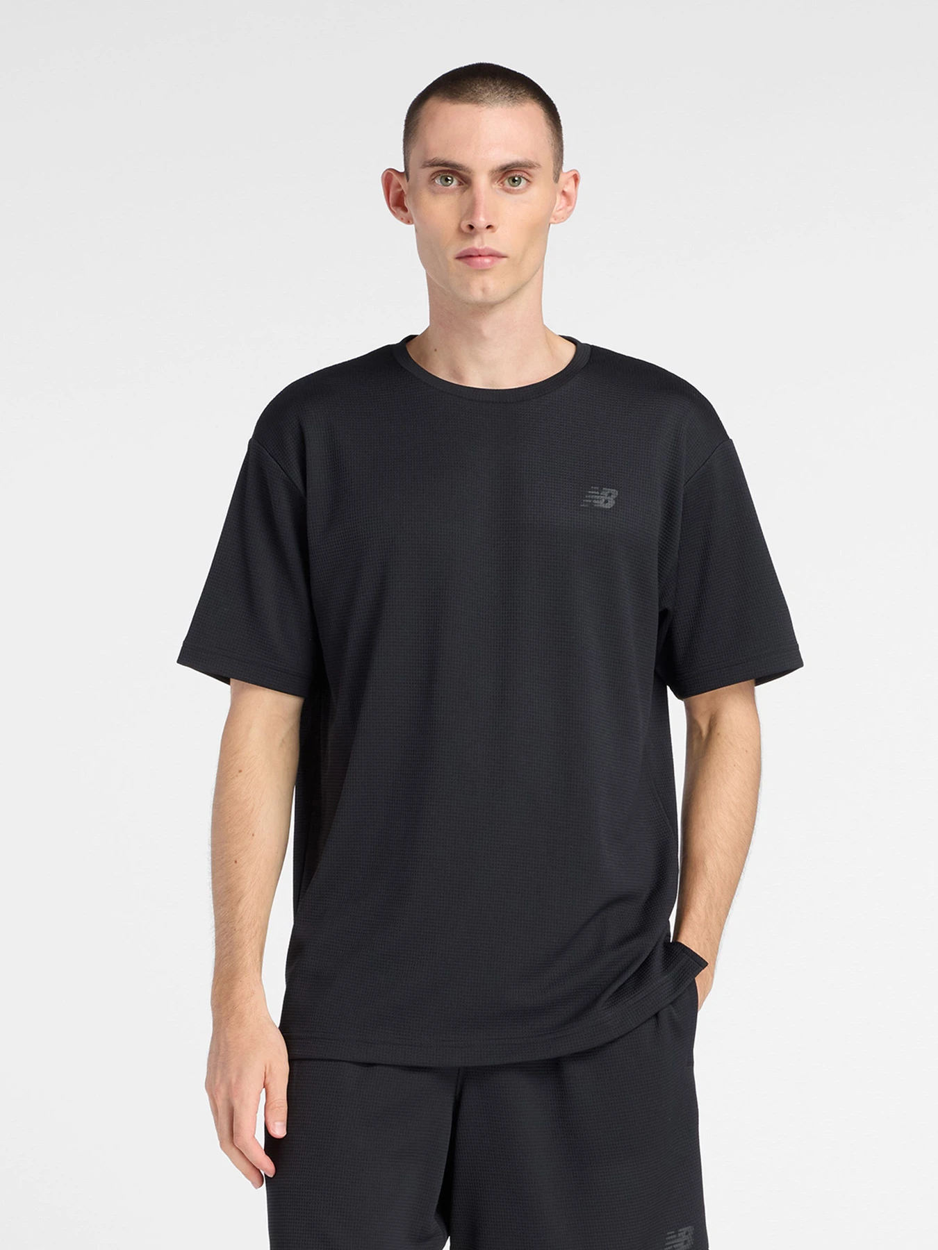 Футболки і поло New Balance TEXTURED CHECK модель MT6100FRBK Футболки і поло New Balance TEXTURED CHECK модель MT6100FRBK Фото
