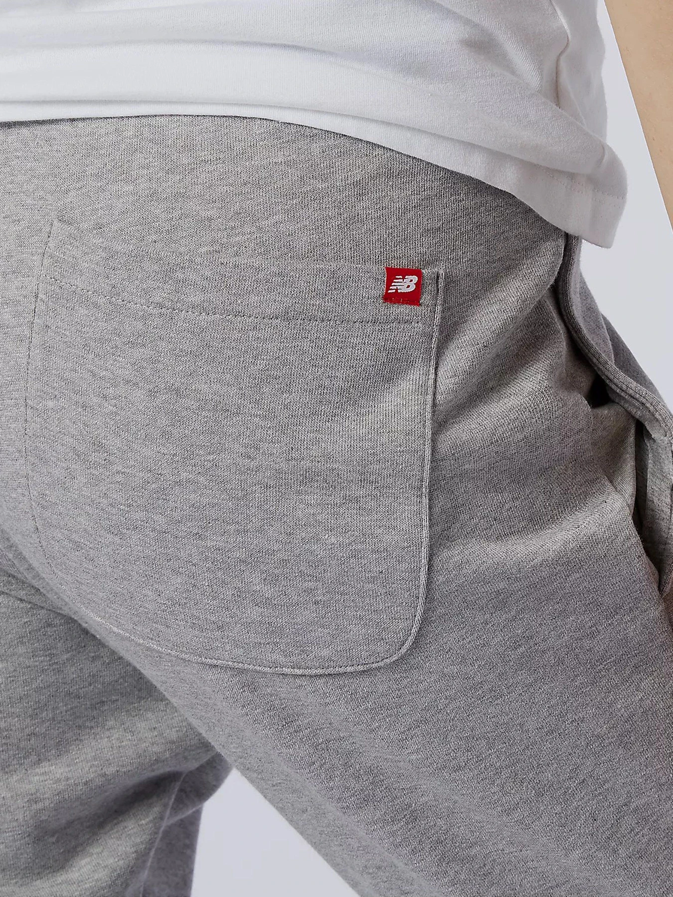 Брюки New Balance Essential Stack Logo модель MP11507AG Брюки New Balance Essential Stack Logo модель MP11507AG Фото