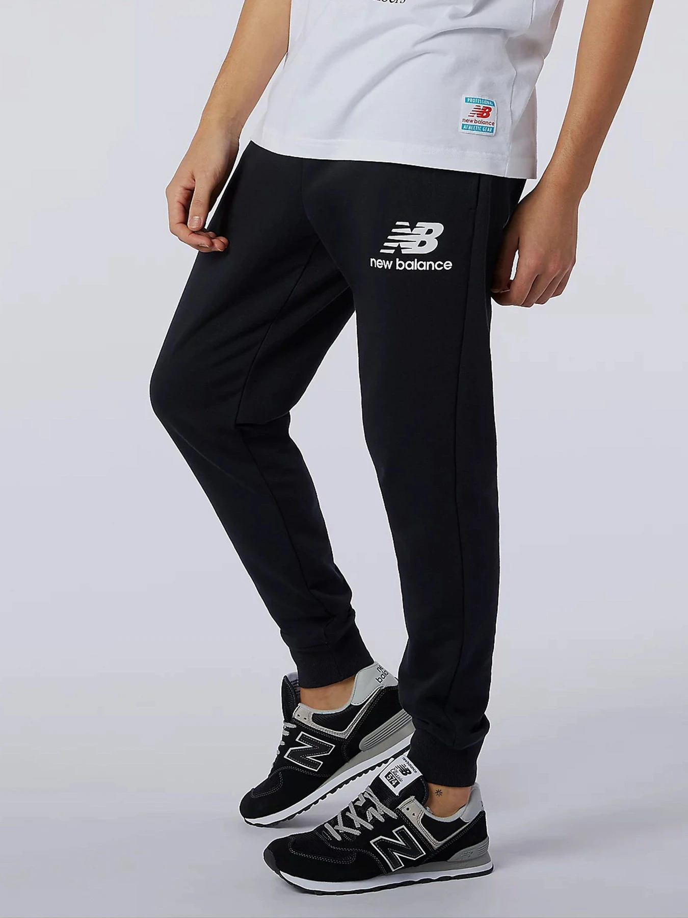 Брюки New Balance Essential Stack Logo модель MP11507BK Брюки New Balance Essential Stack Logo модель MP11507BK Фото