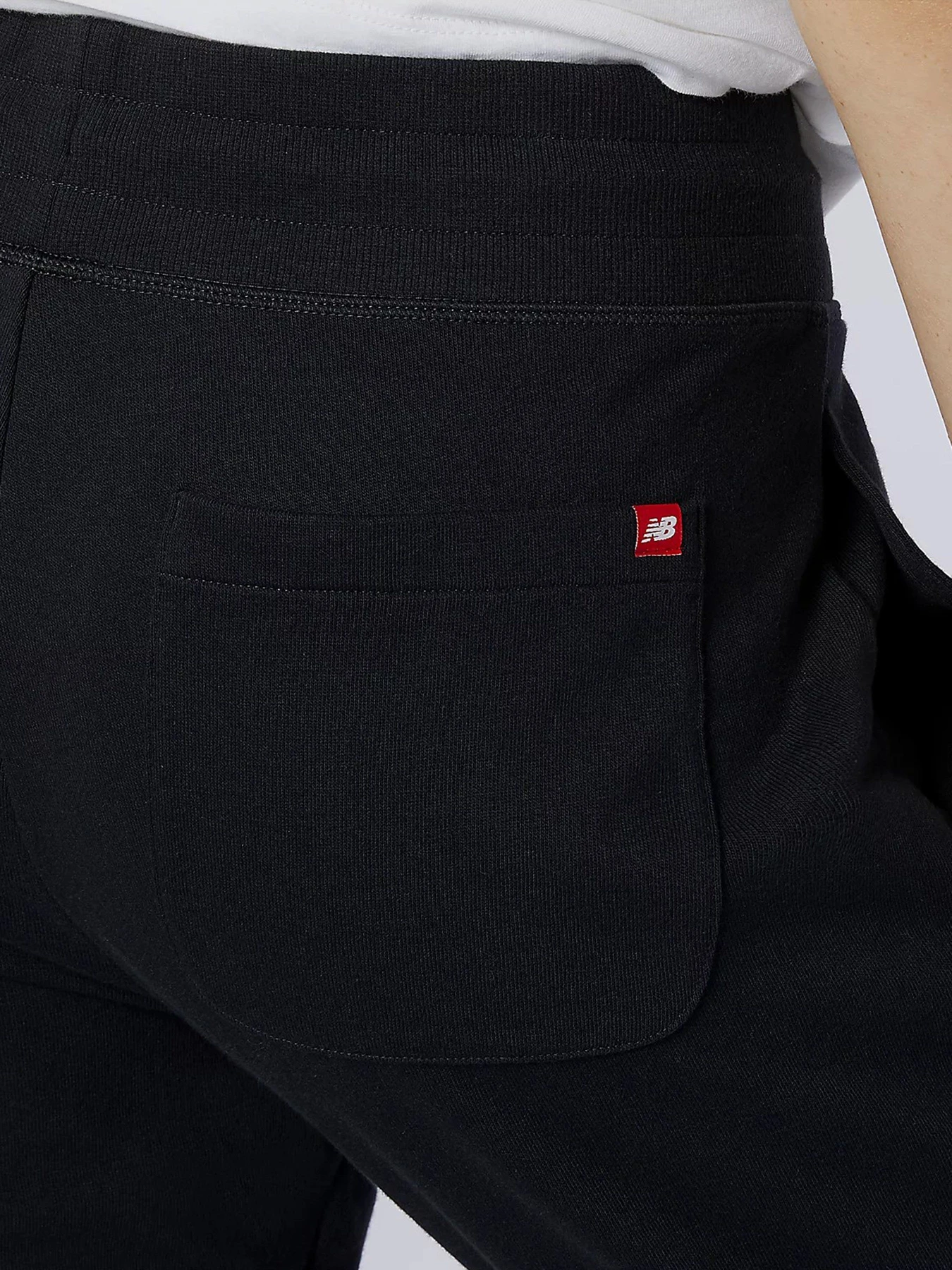 Брюки New Balance Essential Stack Logo модель MP11507BK Брюки New Balance Essential Stack Logo модель MP11507BK Фото