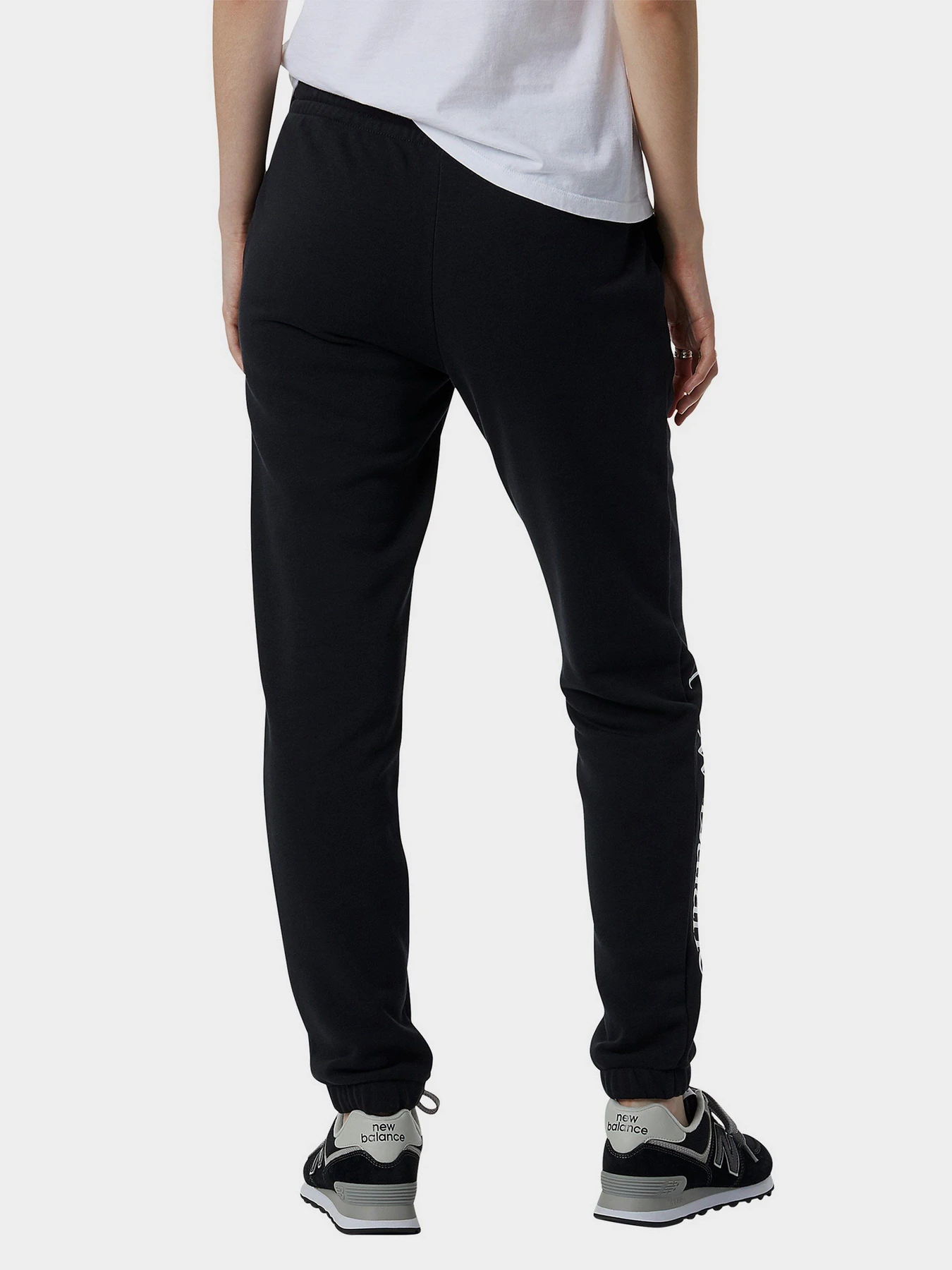 Брюки New Balance Essentials Celebrate Fleece модель WP21508BK Брюки New Balance Essentials Celebrate Fleece модель WP21508BK Фото